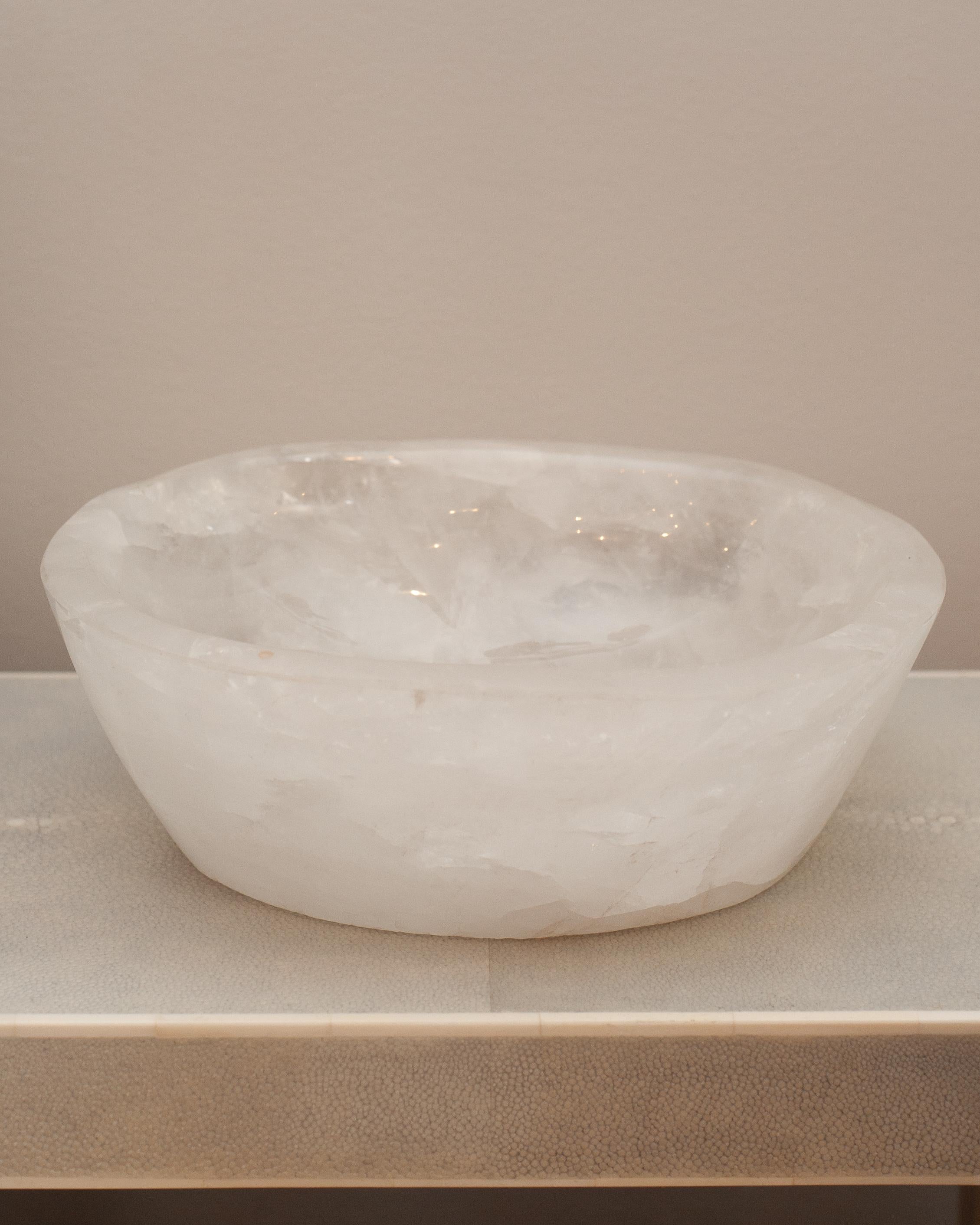 Bring the healing energy of rock crystal into your home with this beautiful carved bowl. This substantial and thick cut bowl can filled with candies or kept sculptural as an empty vessel and placed in any space.