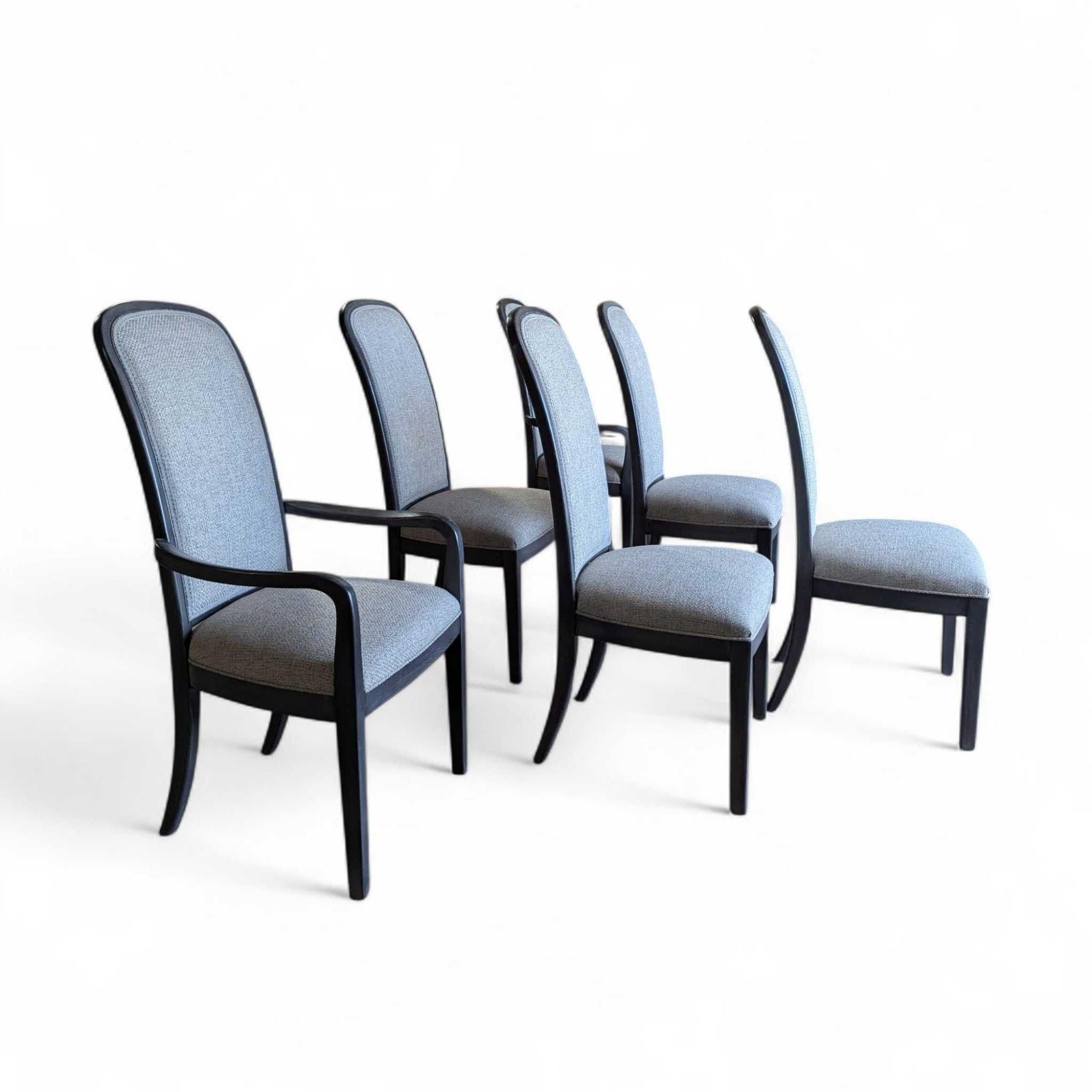 An elegant set of six dining chairs, crafted in wood with a sleek grey-toned finish, featuring newly upholstered seats and backs.

Blending traditional elegance with contemporary simplicity, these chairs offer a refined aesthetic. Each chair boasts
