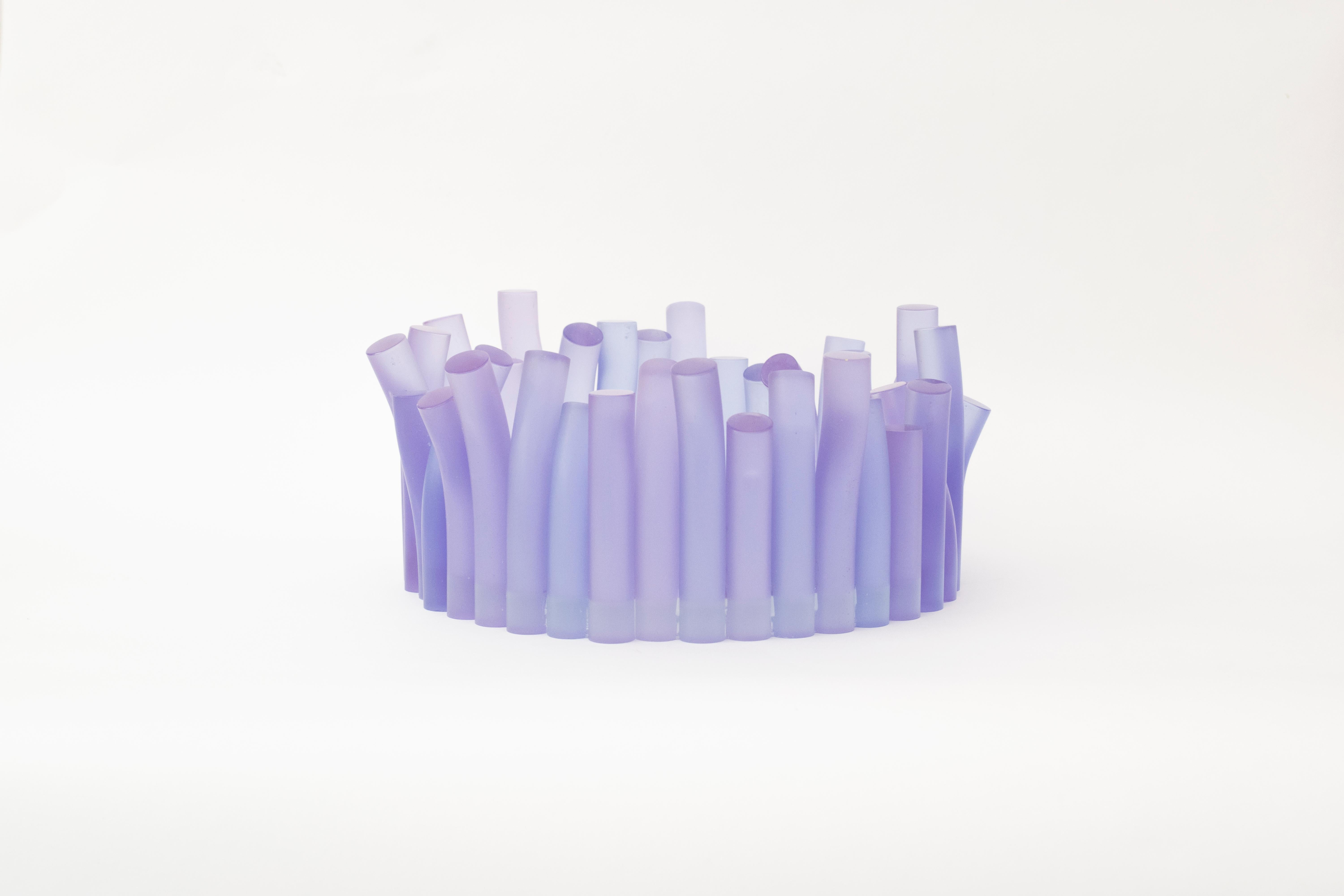 The table centerpiece is entirely handcrafted in transparent resin, dyed and casted into solid rod. Each rod is individually polished and shape to give the bowl its organic complexion. Other colors are available on demand.
