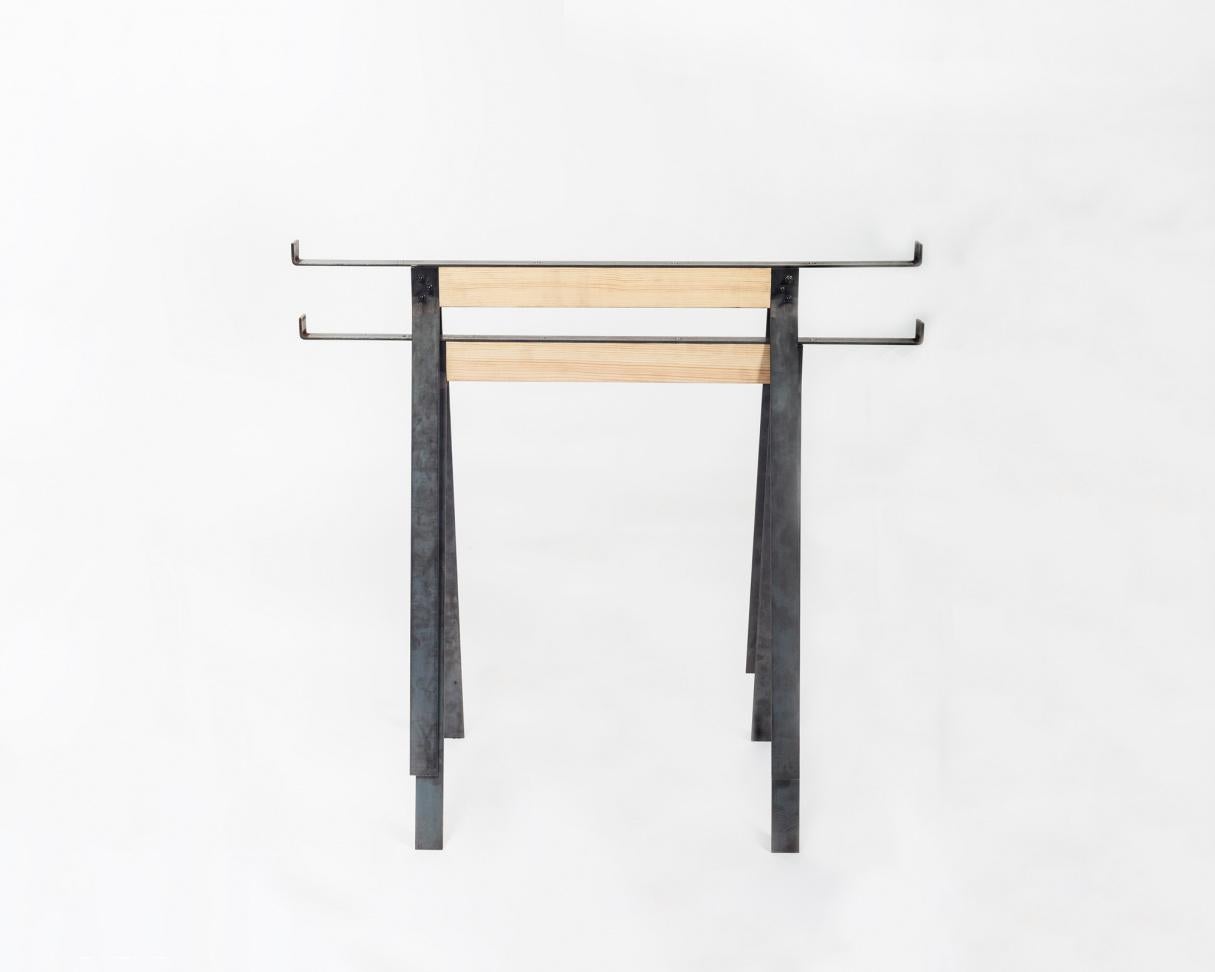The trestles from frama fit a regular table top. Together with the trestles is a simple metal top support bracket. Continuing the collections design approach, the trestles are industrial in their expression, along with a simple but functional joint
