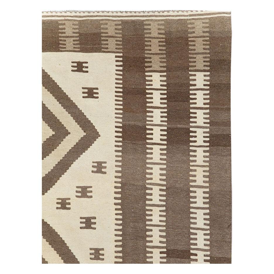 A modern Persian flatwoven Kilim small room size carpet handmade during the 21st century in the tribal style.

Measures: 6' 6