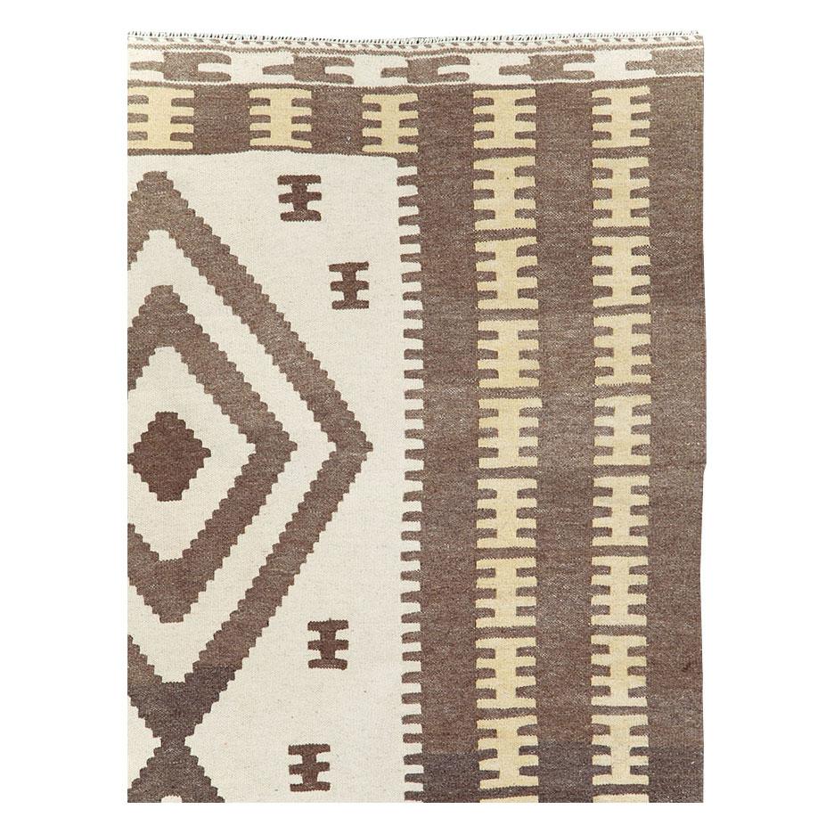 A modern Persian flatwoven Kilim small room size carpet handmade during the 21st century in the tribal style.

Measures: 6' 7