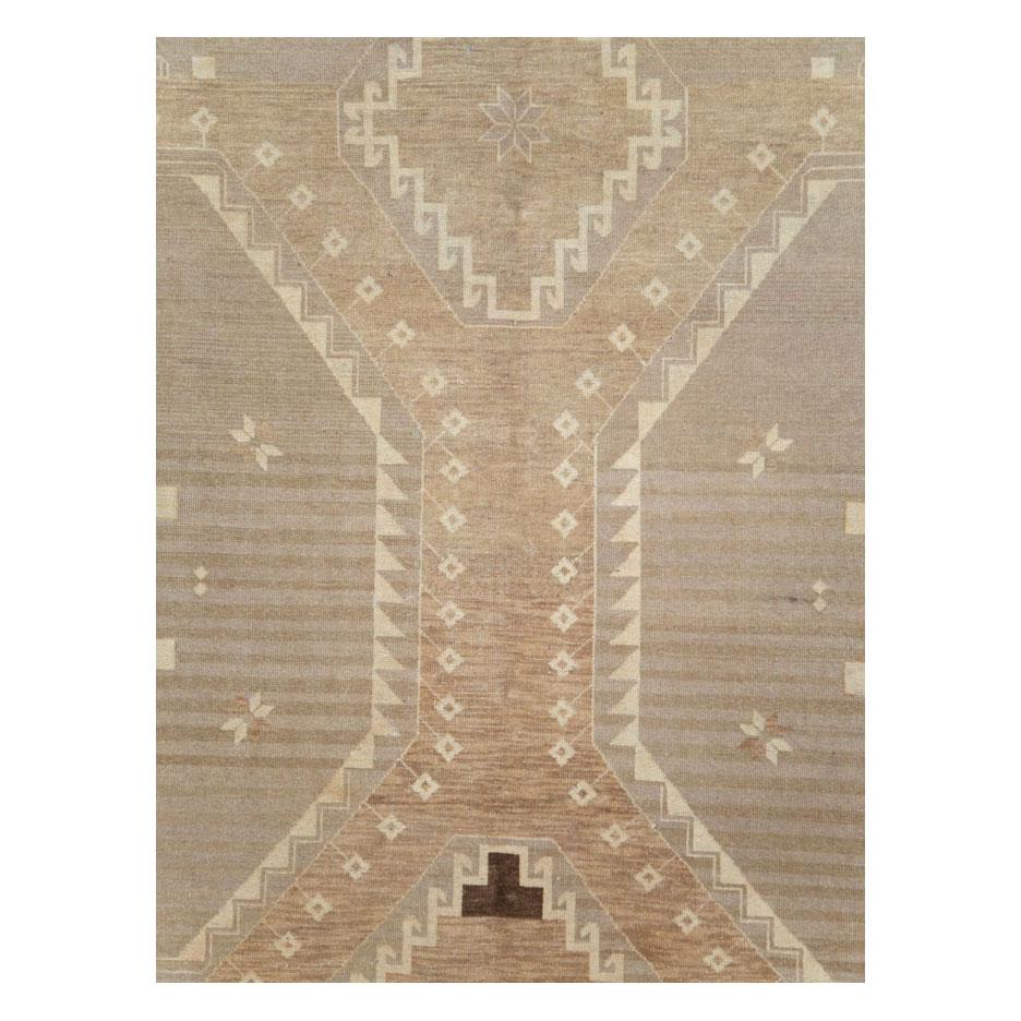 A modern tribal-style Turkish Anatolian room size carpet handmade during the 21st century.

Measures: 9' 3