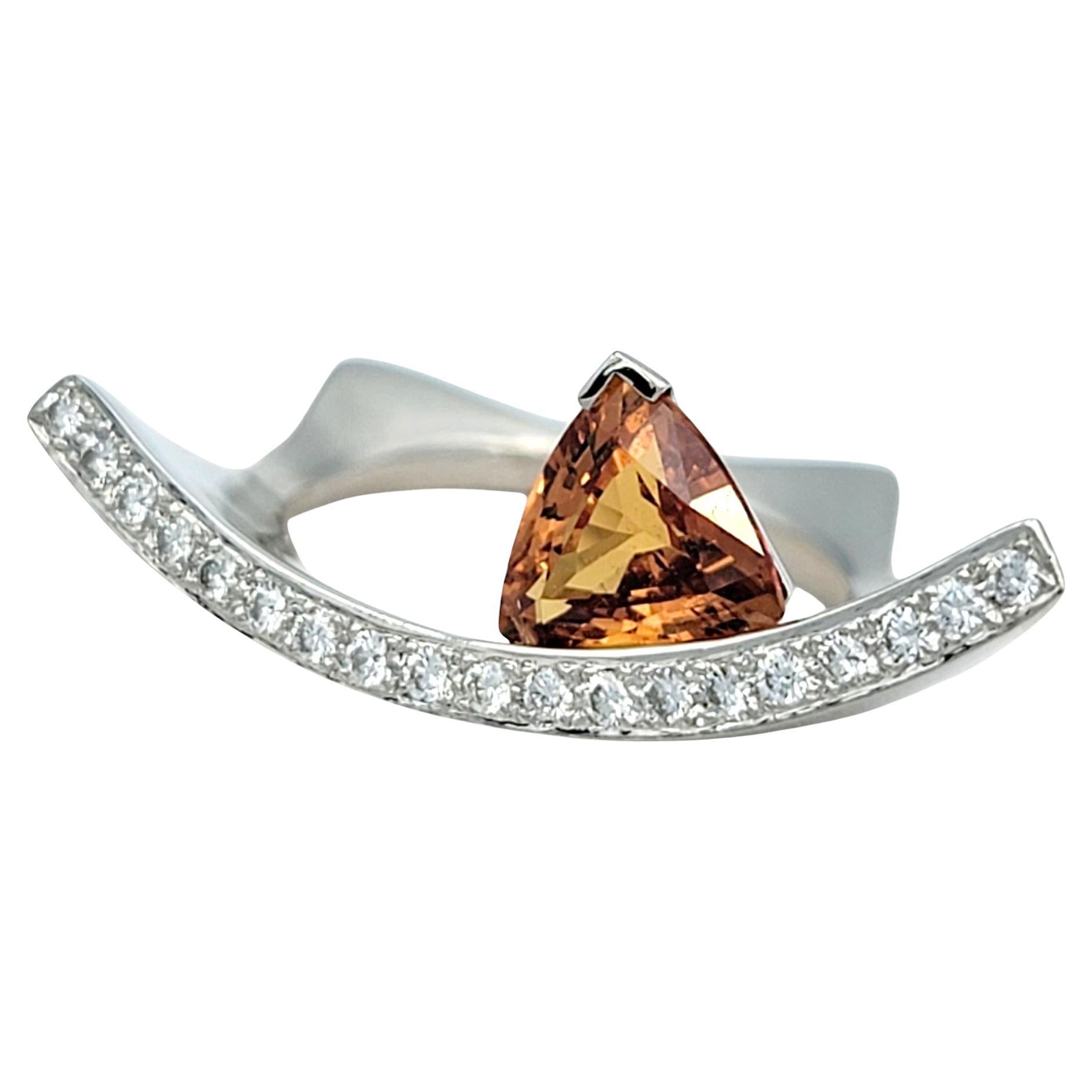 Contemporary Trillion Cut Spessitite and Pave Diamond Ring in 18 Karat Gold For Sale