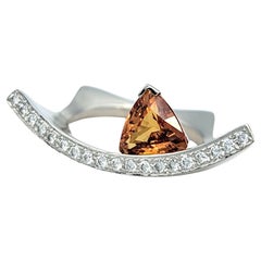 Contemporary Trillion Cut Spessitit und Pave Diamond Ring in 18 Karat Gold