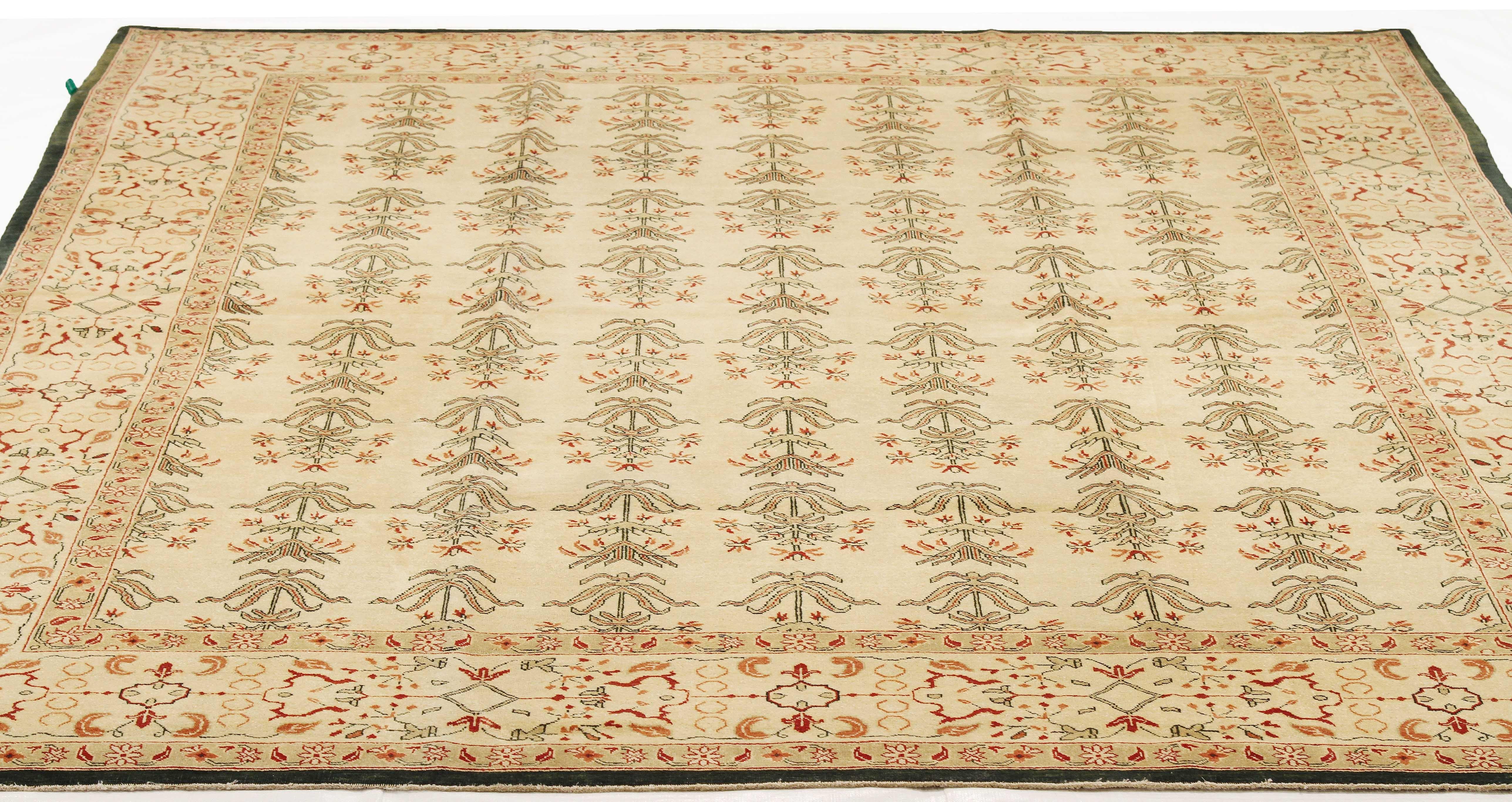 Turkish rug handwoven from the finest sheep’s wool and colored with all-natural vegetable dyes that are safe for humans and pets. It’s a traditional Agra weaving design featuring botanical patterns in beige and brown on a plush ivory field. It’s an