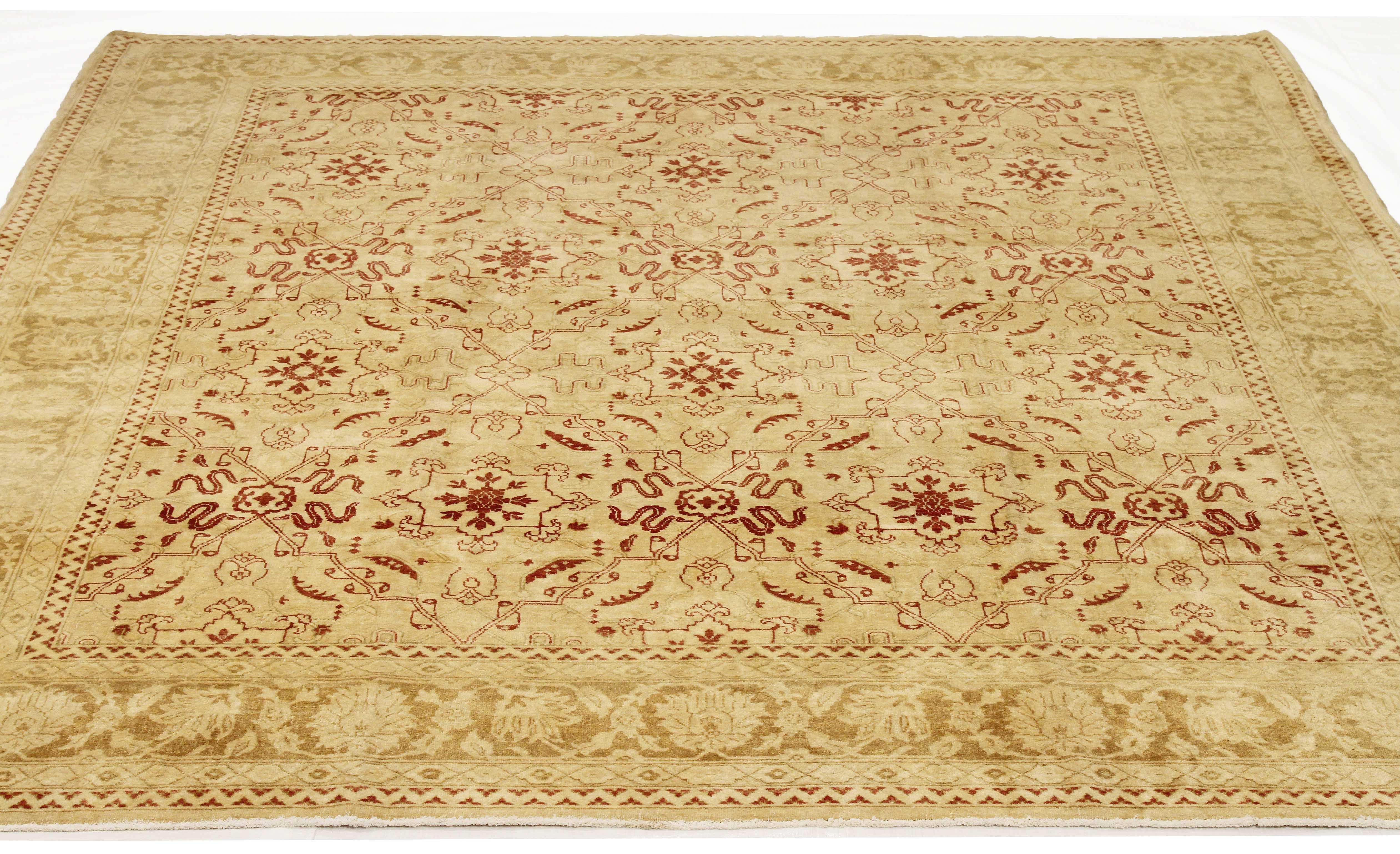 Contemporary Turkish rug handwoven from the finest sheep’s wool and colored with all-natural vegetable dyes that are safe for humans and pets. It’s a traditional Agra weaving design featuring botanical patterns in red and ivory on a plush beige