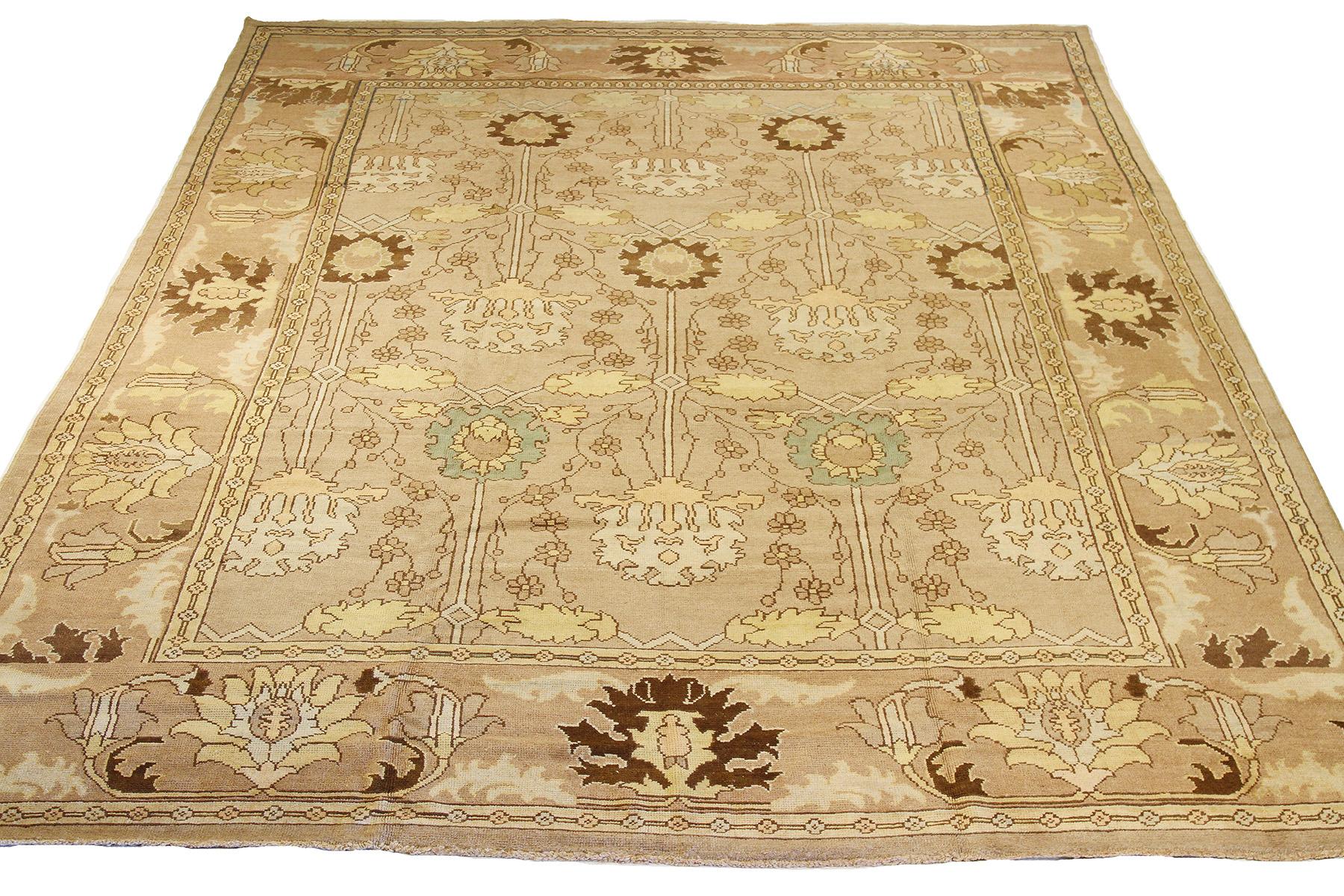 Contemporary handmade Turkish area rug from high-quality sheep’s wool and colored with eco-friendly vegetable dyes that are proven safe for humans and pets alike. It’s a Donegal design showcasing an ivory field with beautiful beige and brown floral