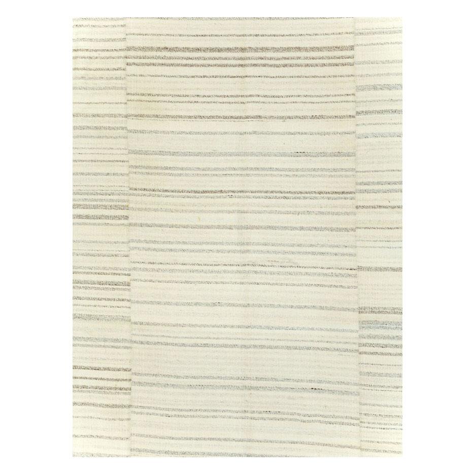 A contemporary Turkish flatweave Kilim room size carpet in beige/cream handmade during the 21st century.

Measures: 9' 6