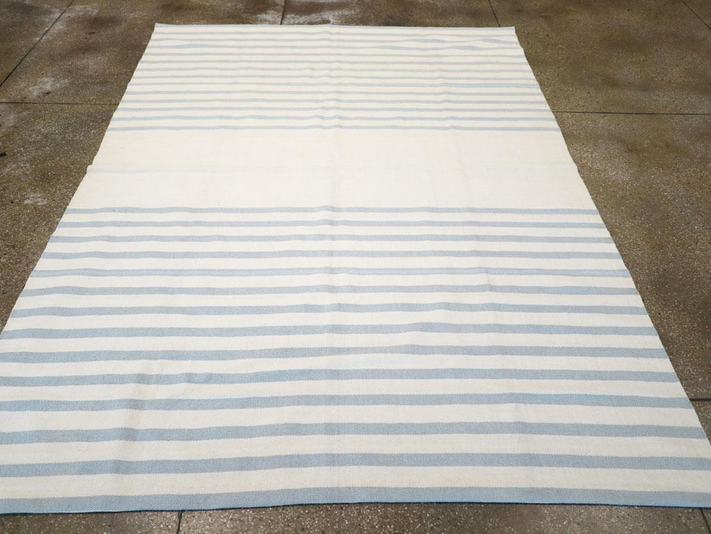 A modern Turkish flatweave Kilim small room size carpet handmade during the 21st century in cream-white and blue-grey stripes.

Measures: 7' 5
