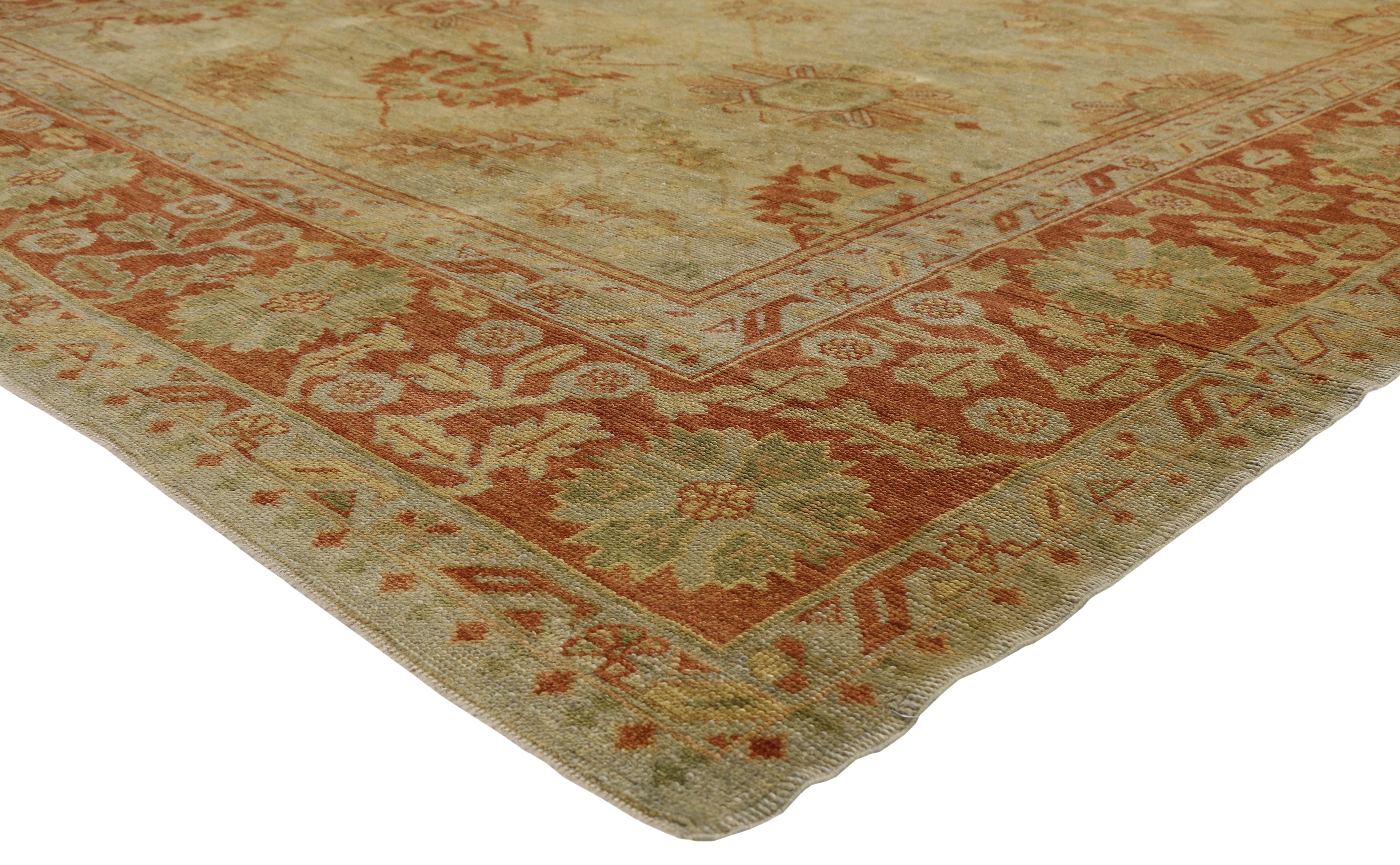 50368, contemporary Turkish Oushak area rug with Spanish Colonial style. This hand-knotted wool contemporary Turkish Oushak rug features large-scale stylized palmettes and lush serrated leaves connected with angular vines on an abrashed field. The