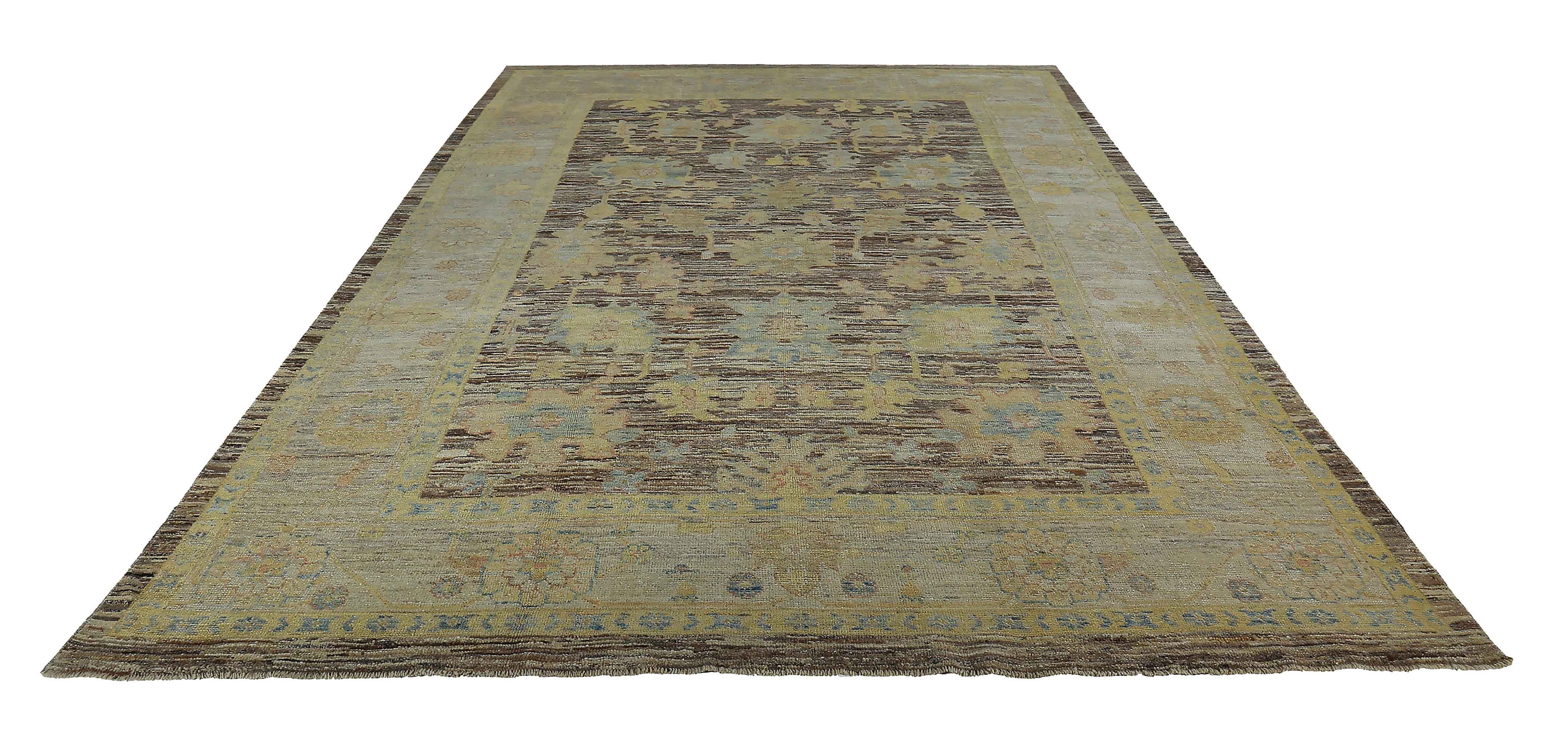 Contemporary Turkish rug made of handwoven sheep’s wool of the finest quality. It’s colored with organic vegetable dyes that are certified safe for humans and pets alike. It features ivory and gold floral details on a rich brown field. Flower