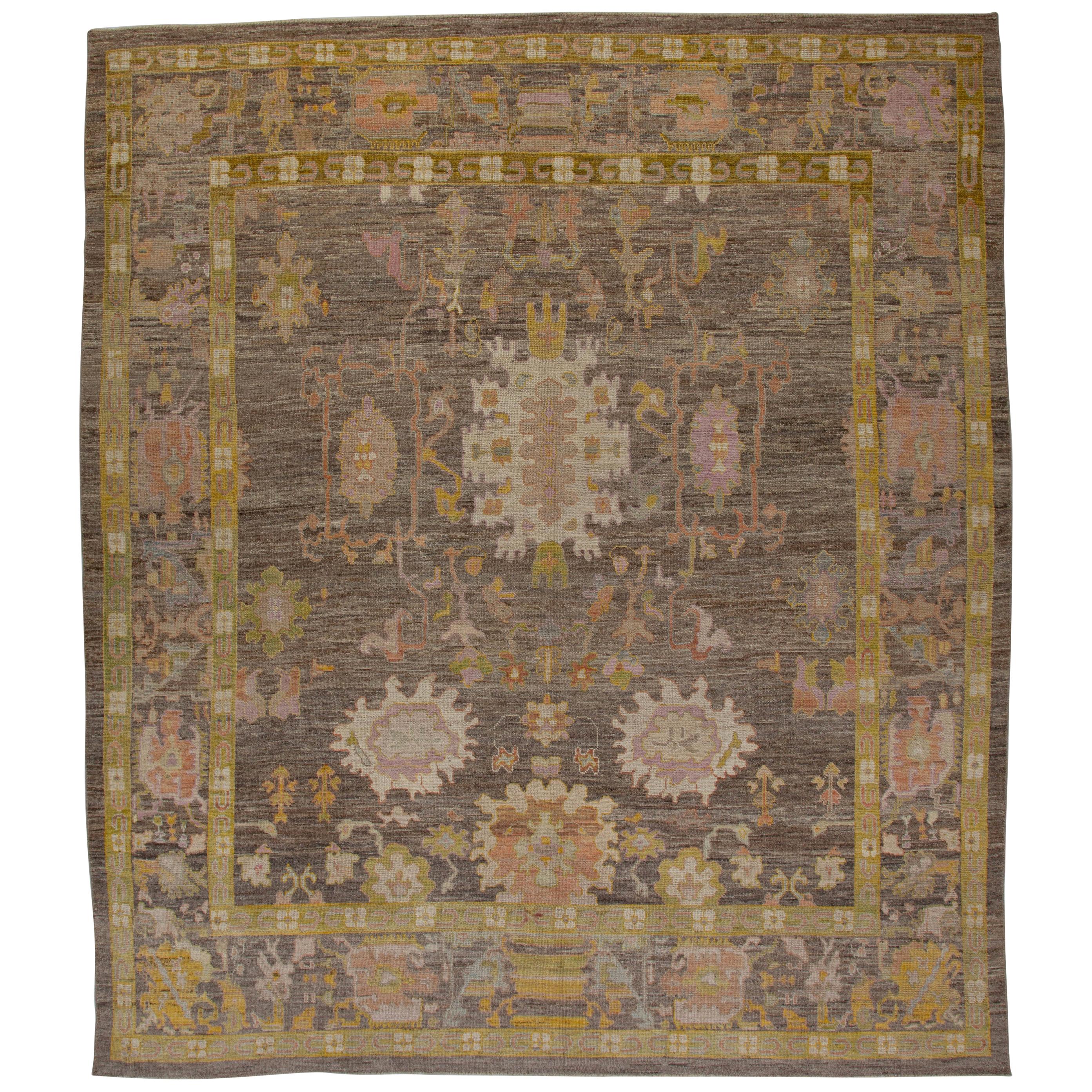Contemporary Turkish Oushak Rug with a Brown Field and Gold Borders For Sale