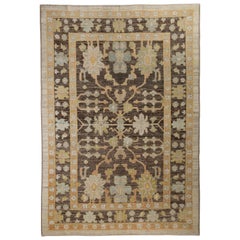 Contemporary Turkish Oushak Rug with Brown Field and Flower Head Details