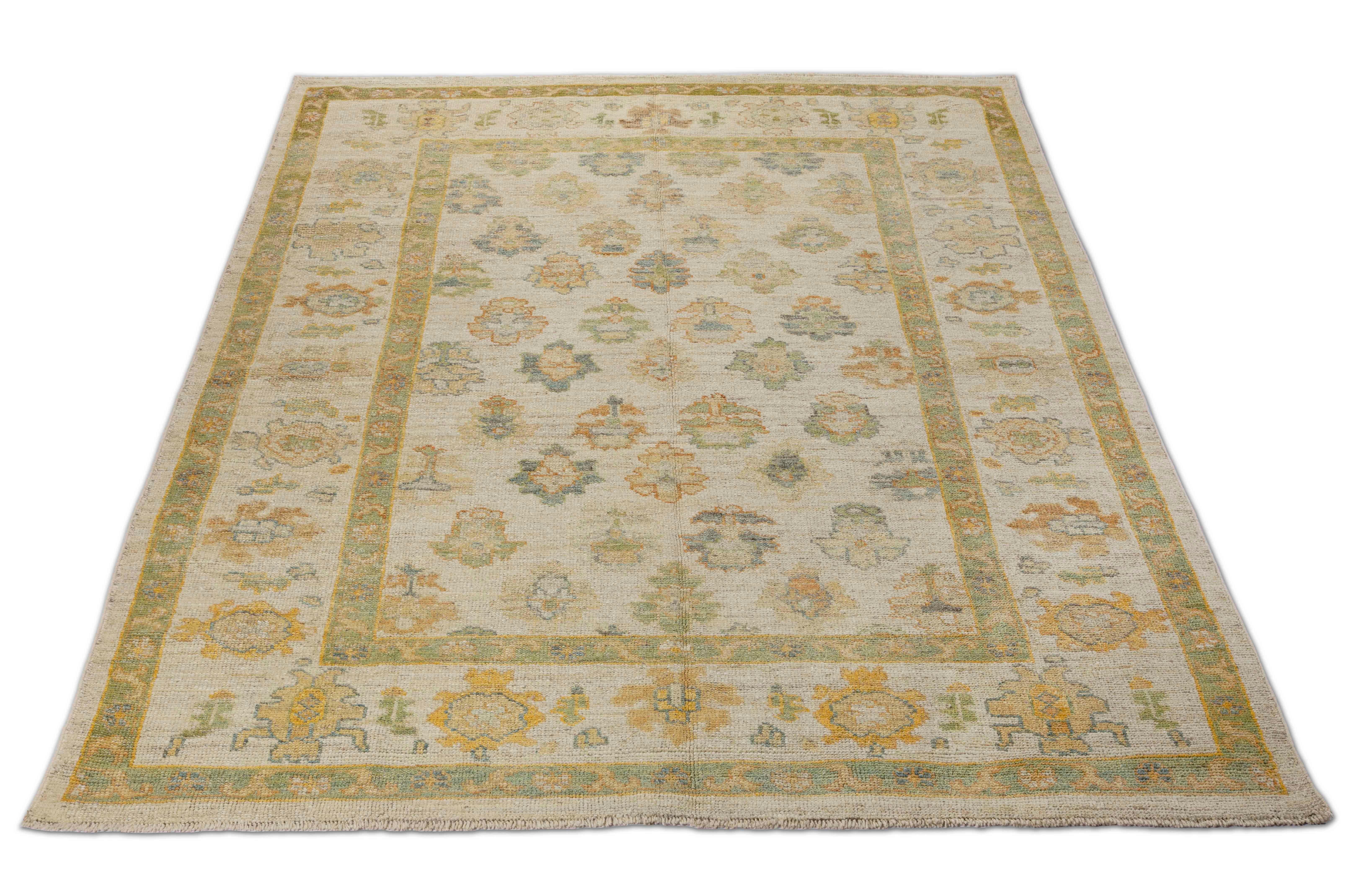Contemporary Turkish rug made of handwoven sheep’s wool of the finest quality. It’s colored with organic vegetable dyes that are certified safe for humans and pets alike. It features a large, beige field with flower details allover associated with