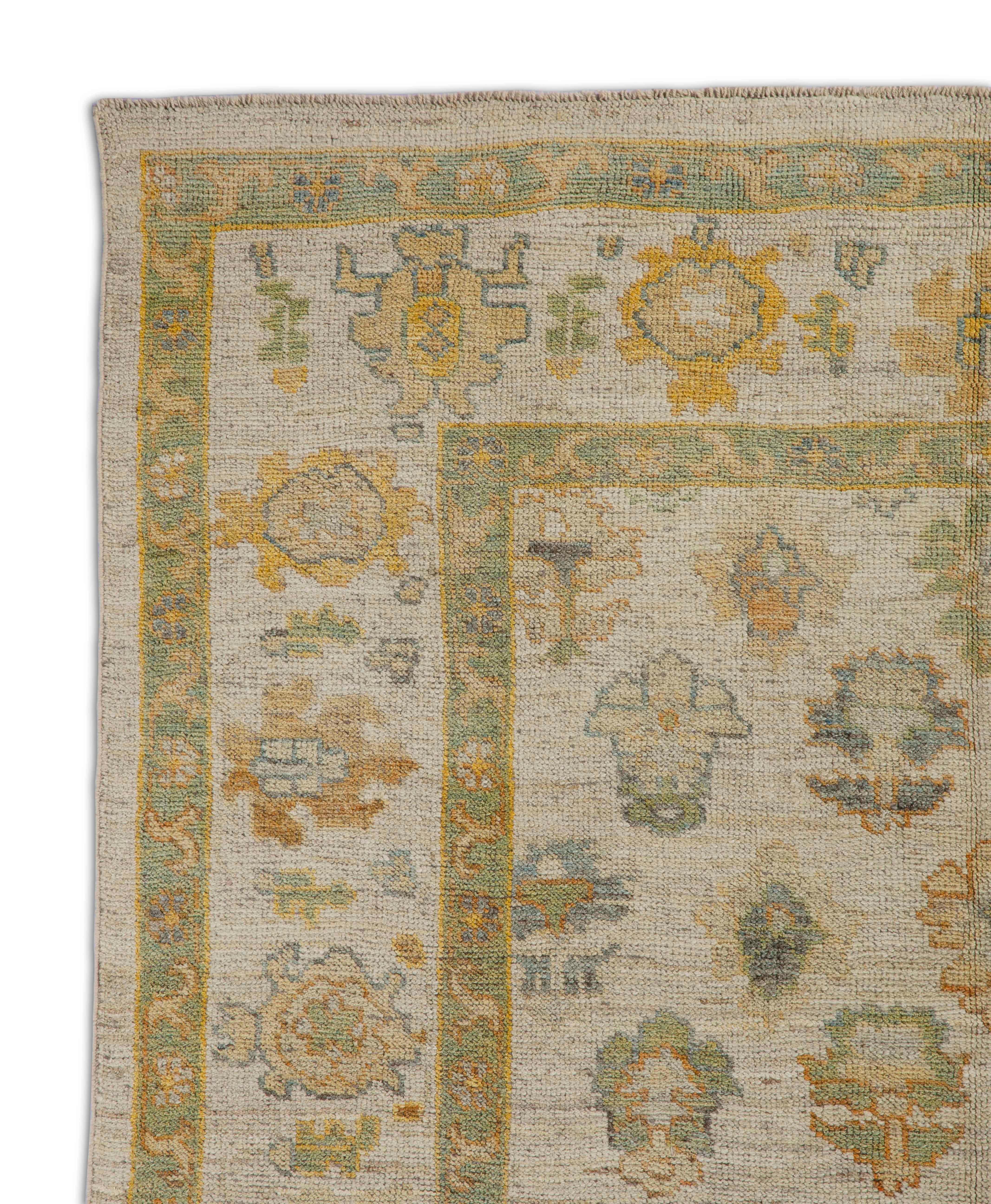 Hand-Woven Contemporary Turkish Oushak Rug with Flower Heads Pattern over Beige Field For Sale