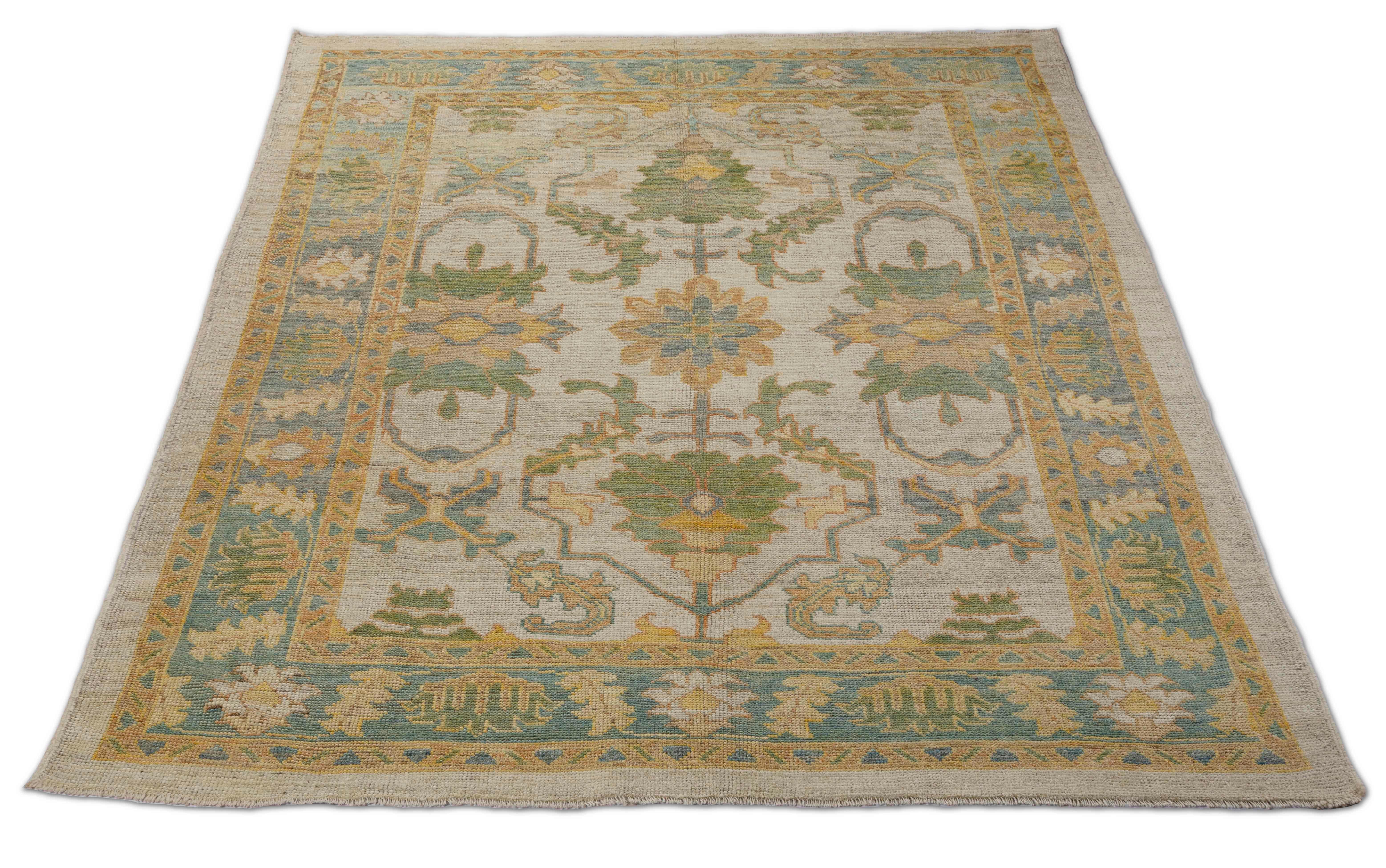 New Turkish rug made of handwoven sheep’s wool of the finest quality. It’s colored with organic vegetable dyes that are certified safe for humans and pets alike. It features a large, beige field with flower details allover in green and blue