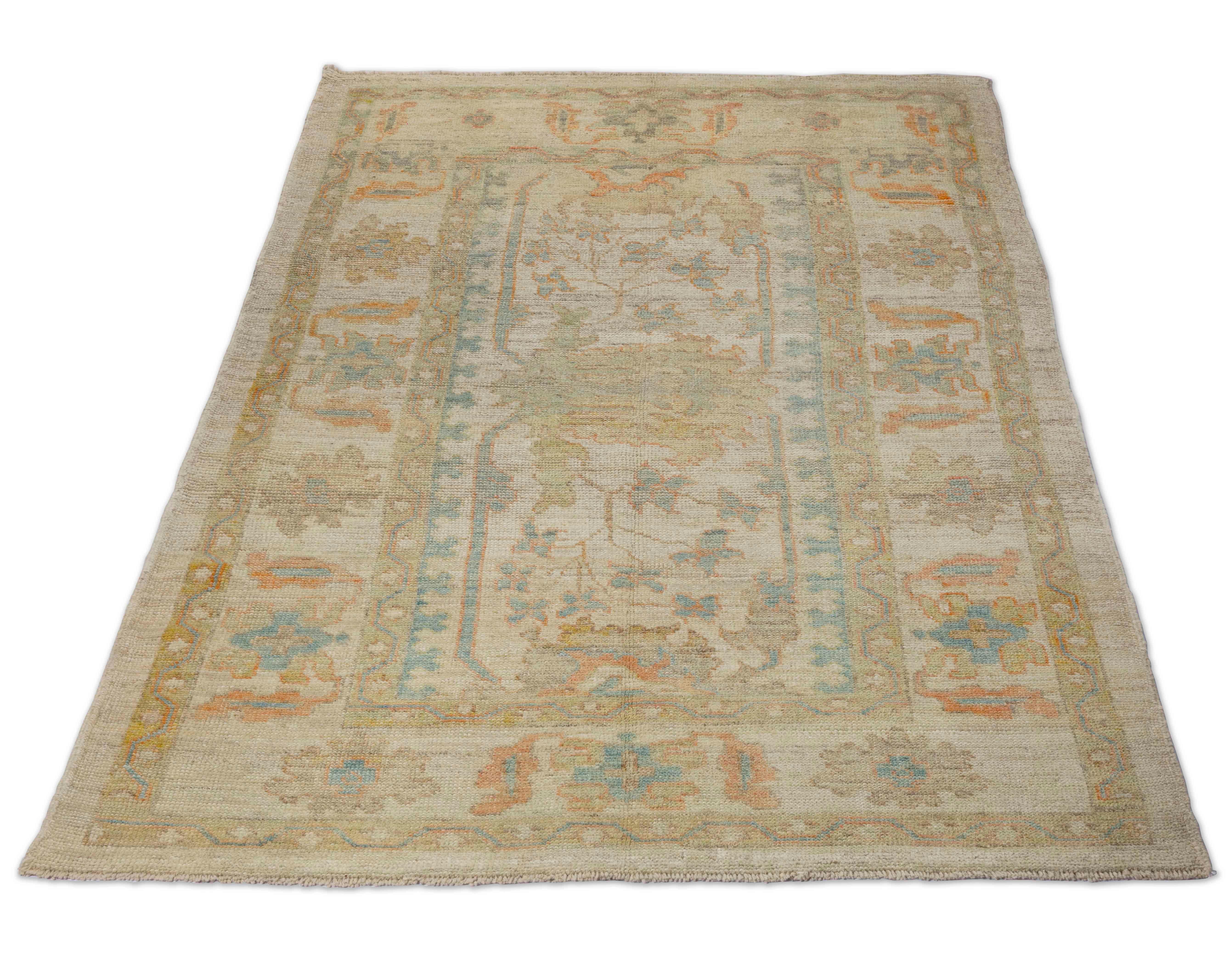 New Turkish rug made of handwoven sheep’s wool of the finest quality. It’s colored with organic vegetable dyes that are certified safe for humans and pets alike. It features a large, beige and gray field with flower details allover associated with