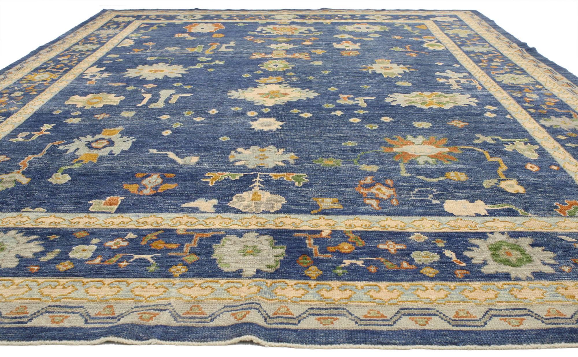 52243 contemporary Turkish Oushak rug with modern style. This unique Contemporary Turkish Oushak rug features a classic design in a modern style, geometric floral symbols and boteh are scattered over a deep sea of blue sapphire. Geometric flowers