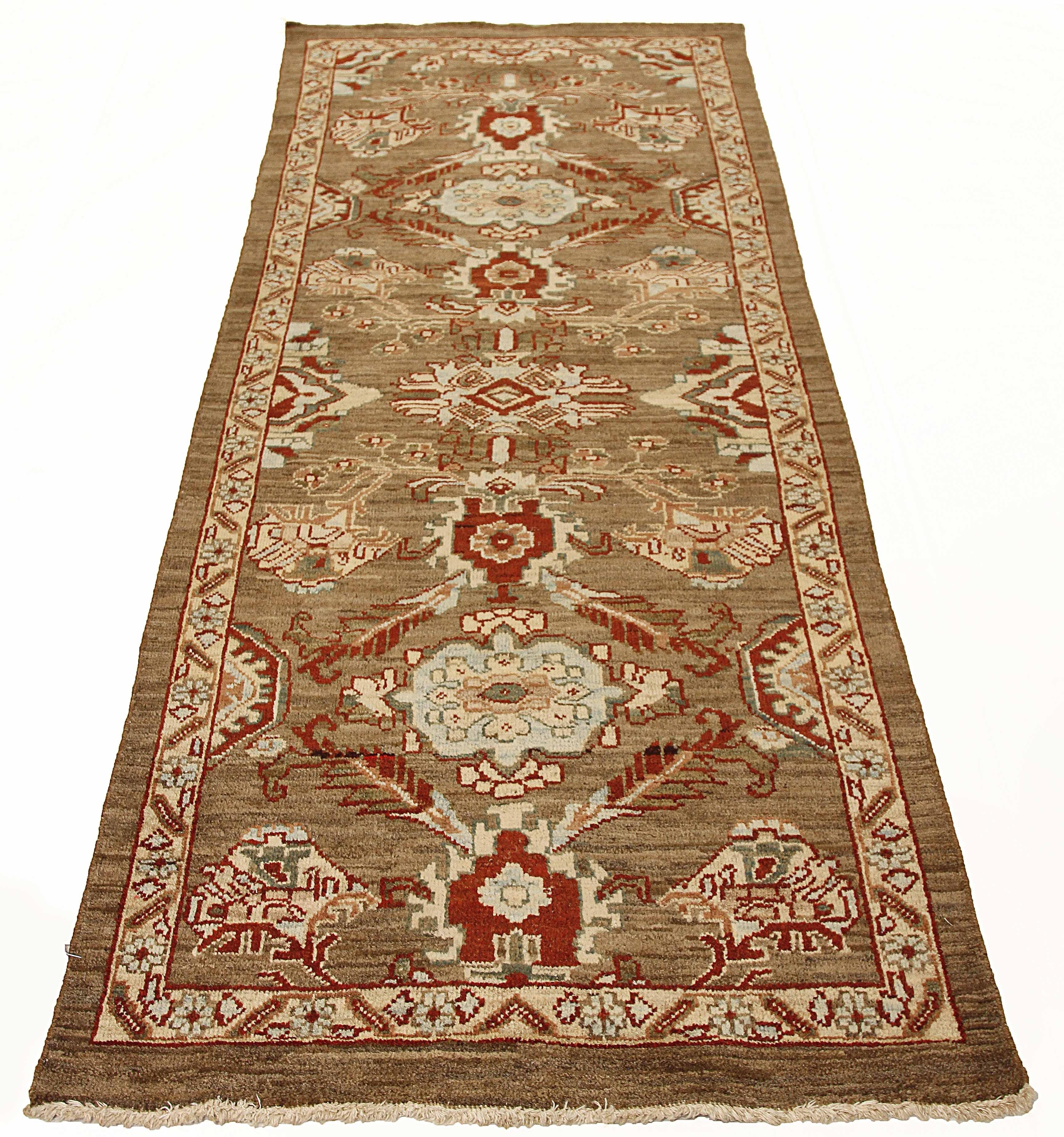Contemporary Turkish runner rug made of handwoven sheep’s wool of the finest quality. It’s colored with organic vegetable dyes that are certified safe for humans and pets alike. It features flower details in red and blue all-over associated with