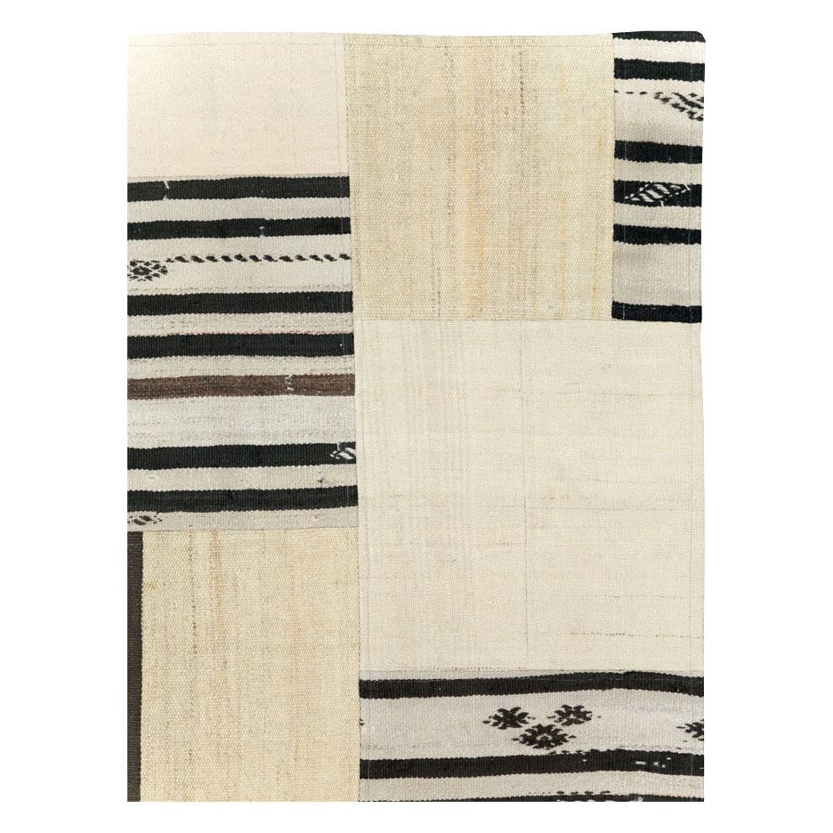 A contemporary Turkish patchwork style flatweave accent rug created during the 21st century using remnants of vintage Turkish flatweave Kilim rugs from the mid-20th century period. 

Measures: 6' 0