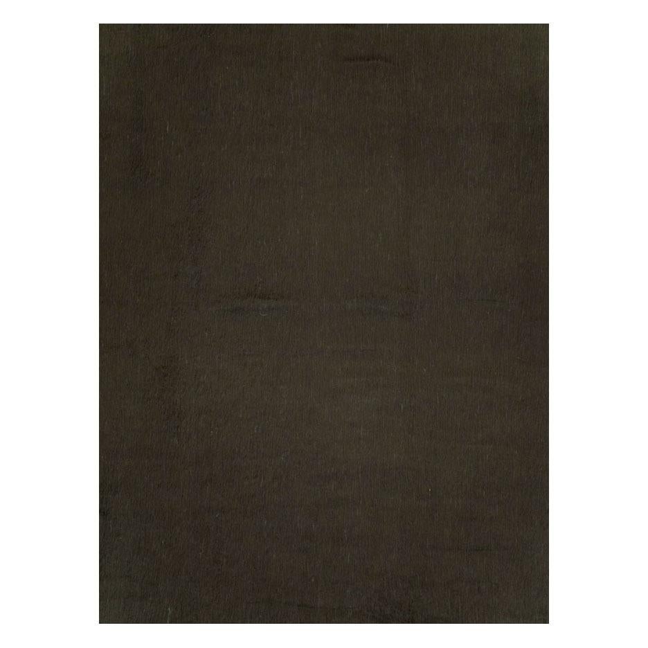 A modern Turkish Mohair room size carpet with a dark brown to black-colored long and lustrous pile from the 21st century in the style of minimalism. It may be used as a stand-alone piece or the foundation of a layered look.

Measures: 9' 9