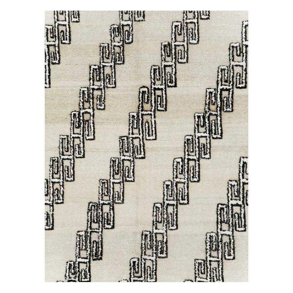 A modern Turkish room size carpet with a diagonally hooked pattern in black and white over a beige ground handmade during the 21st century.

Measures: 8' 6