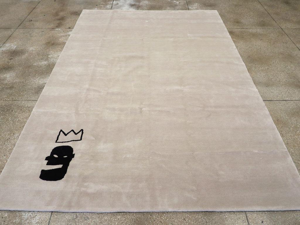 A modern Turkish room size carpet handmade during the 21st century in the style of Jean-Michel Basquiat.

Measures: 8' 1