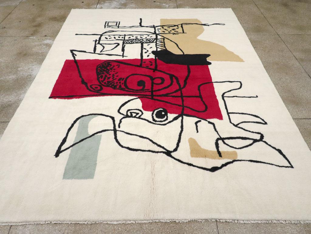 Un tapis turc moderne, fabriqué à la main au cours du 21e siècle dans le style de Le Corbusier.

Mesures : 9' 0