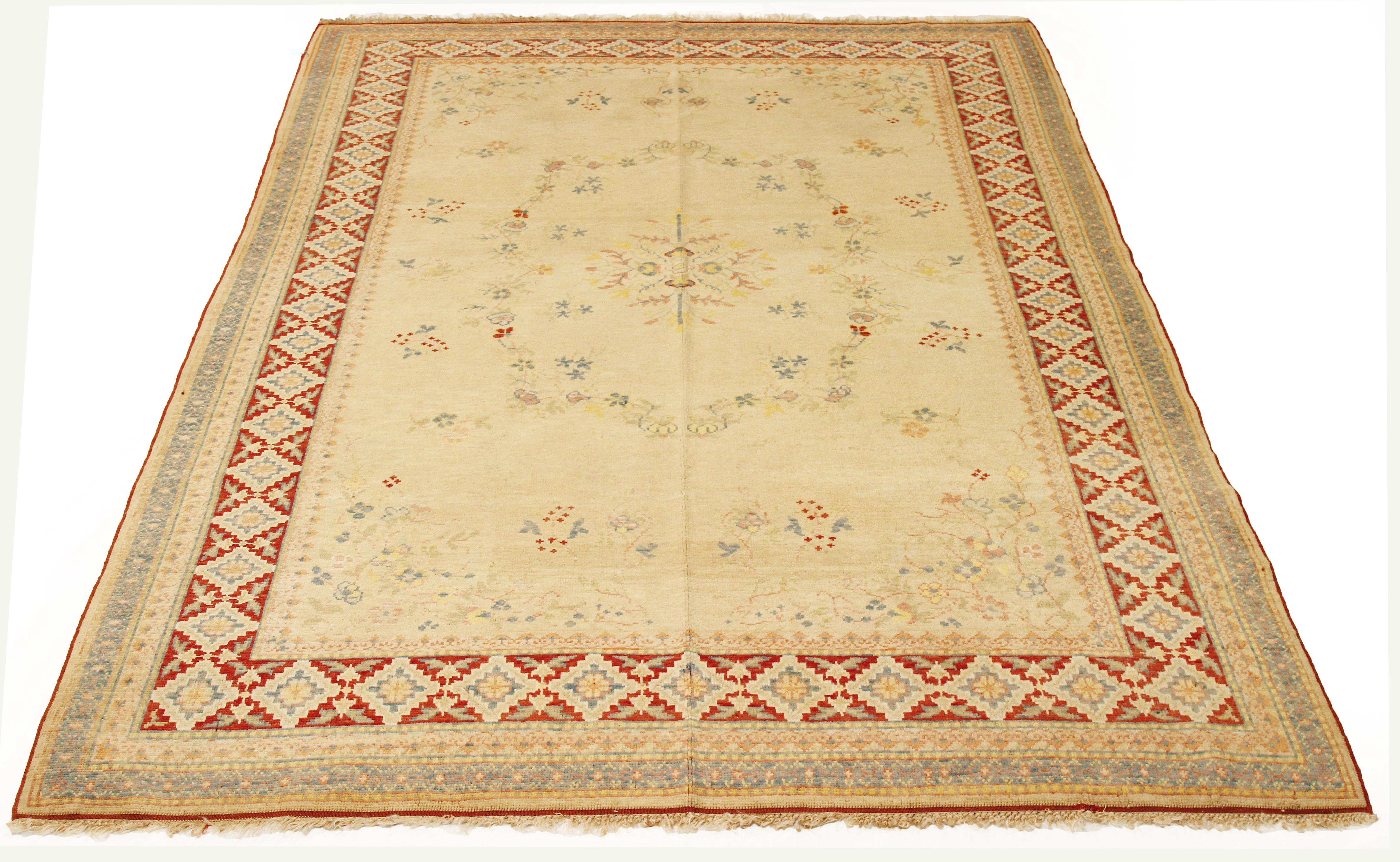 Contemporary Turkish rug handwoven from the finest sheep’s wool and colored with all-natural vegetable dyes that are safe for humans and pets. It’s a traditional Turkish design featuring pastel-colored floral details on an ivory field. It’s a lovely