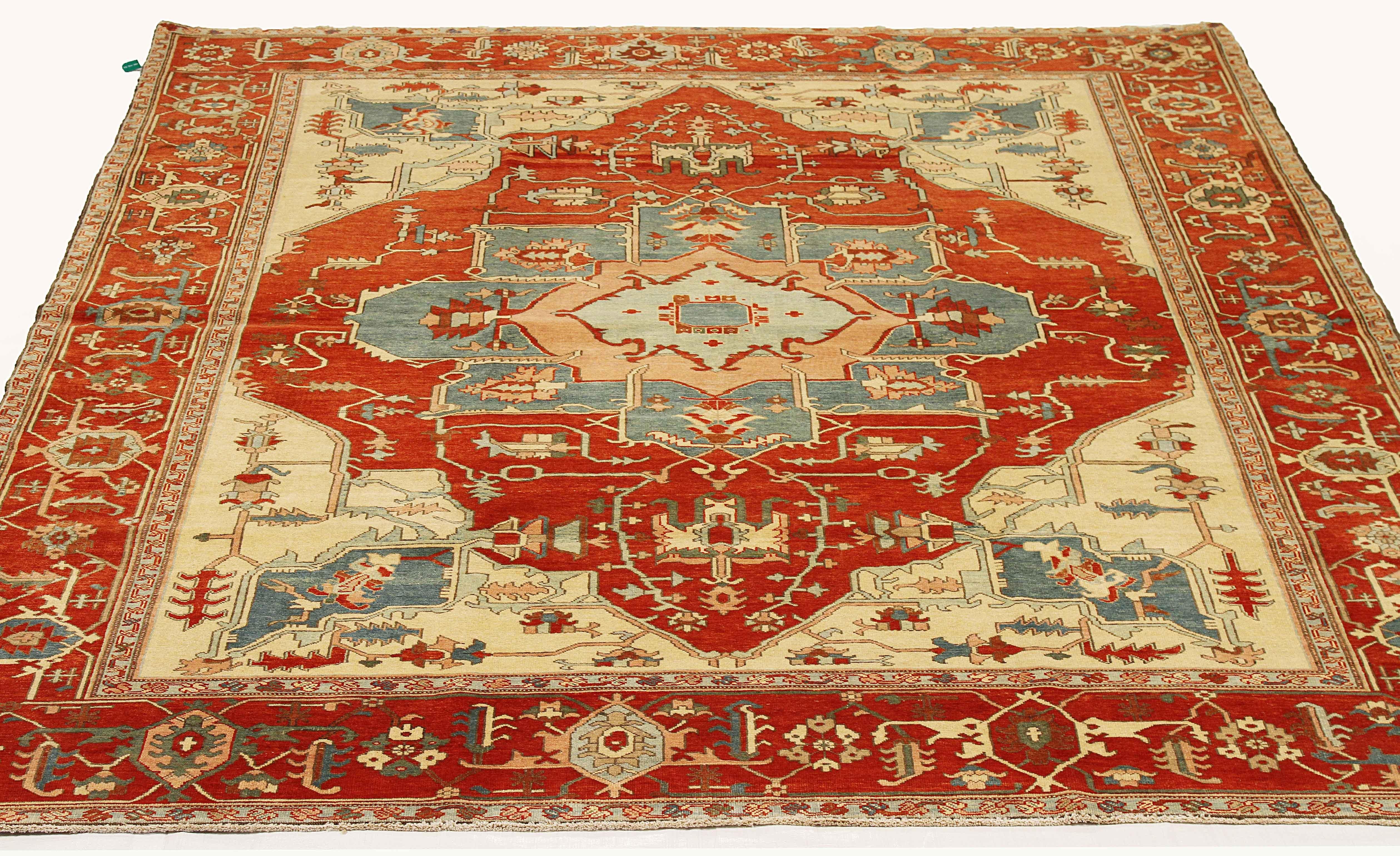 Contemporary Turkish rug handwoven from the finest sheep’s wool and colored with all-natural vegetable dyes that are safe for humans and pets. It’s a traditional Serapi weaving featuring a lovely ensemble of botanical designs in red and gray over an