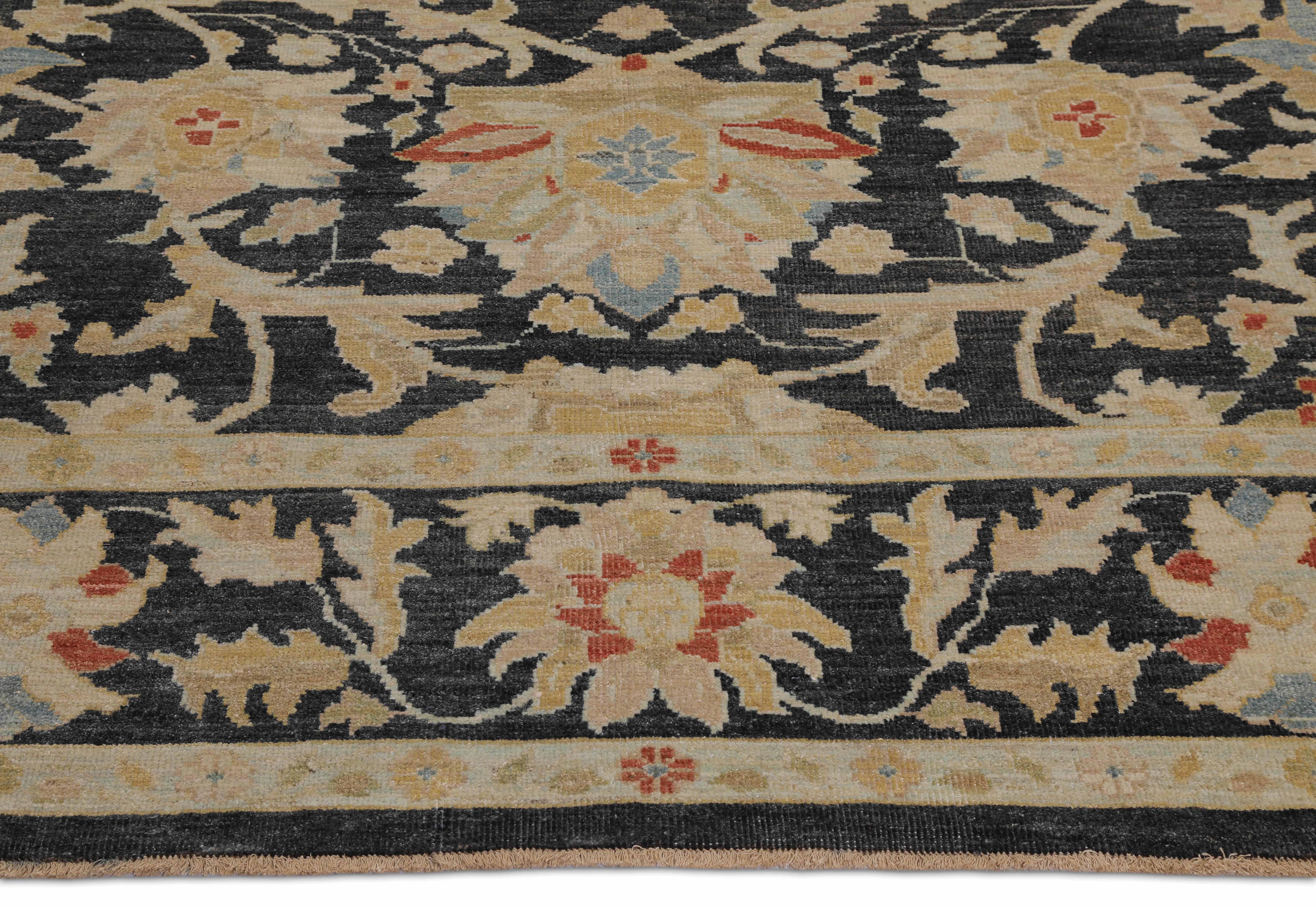 Handmade Turkish area rug from high-quality sheep’s wool and colored with eco-friendly vegetable dyes that are proven safe for humans and pets alike. It’s a Classic Sultanabad design featuring a regal black field with a colored mix of Herati flower