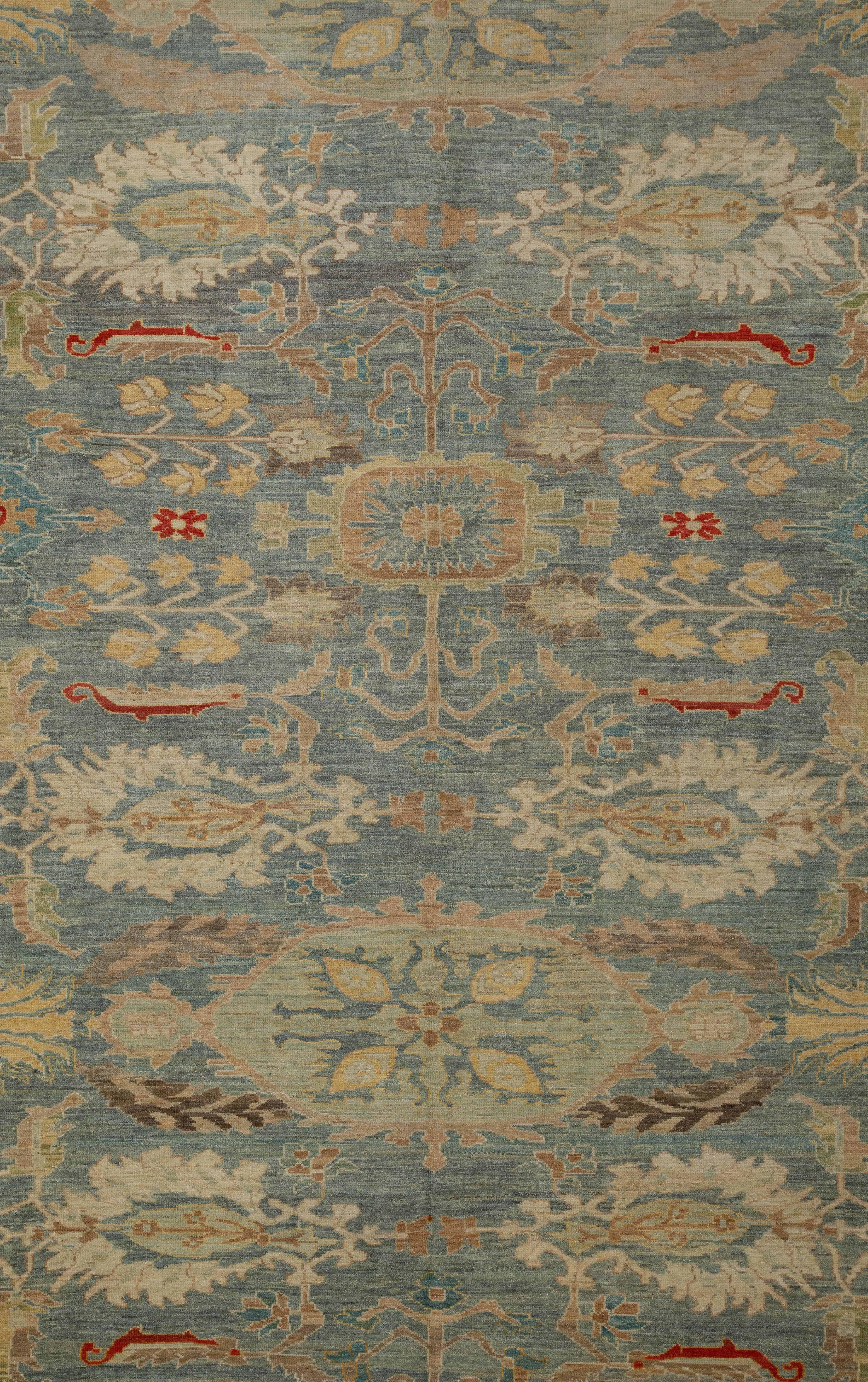Handmade Turkish area rug from high quality sheep’s wool and colored with eco-friendly vegetable dyes that are proven safe for humans and pets alike. It’s a classic Sultanabad design featuring a beautiful blue field with a colored mix of flowers in