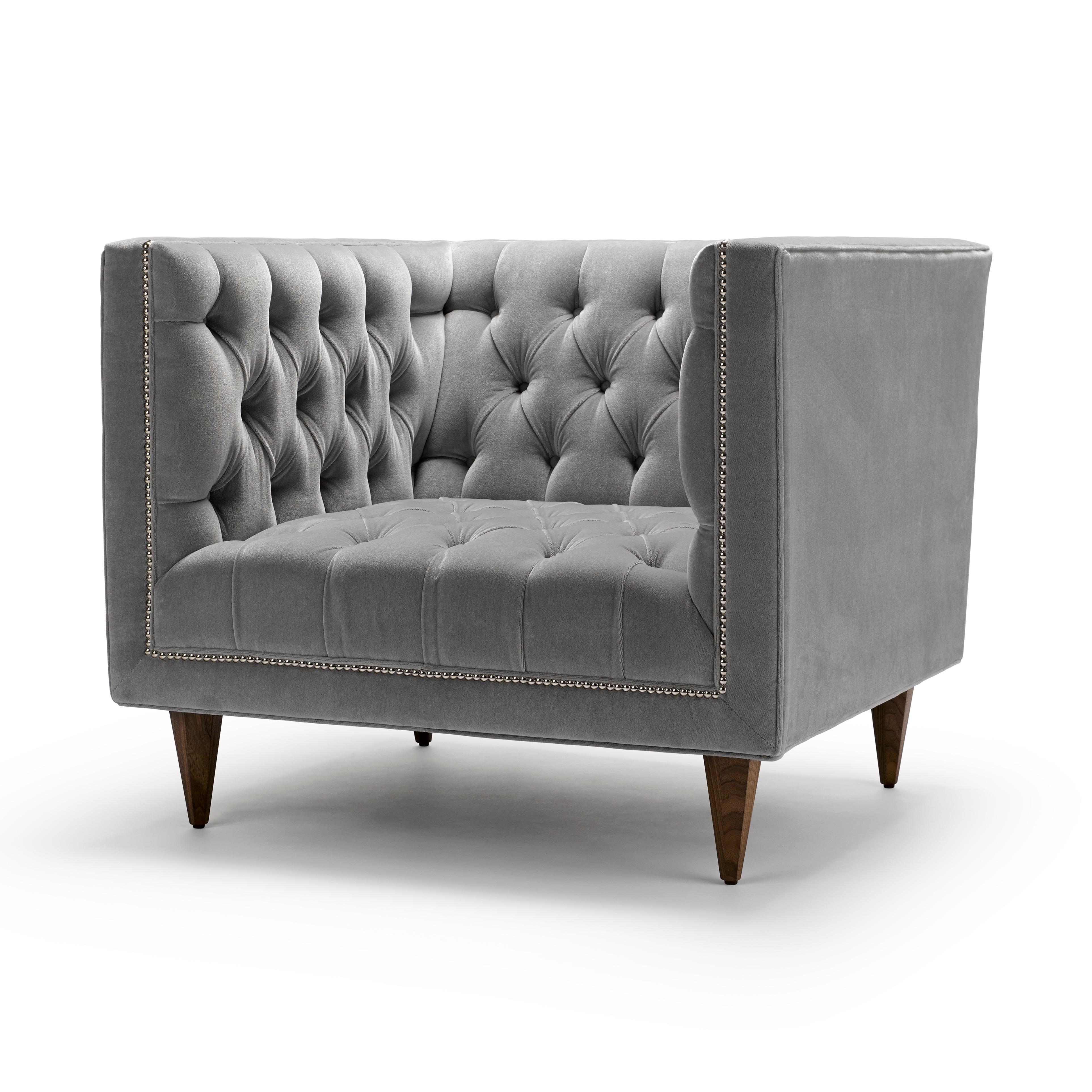 The Tux Chair is our contemporary interpretation of the Classic Chesterfield. The deep buttoning and tailored detailing make this piece a personal favourite. Shown here upholstered in Fox Linton Mohair Velvet, with legs in natural oiled walnut and