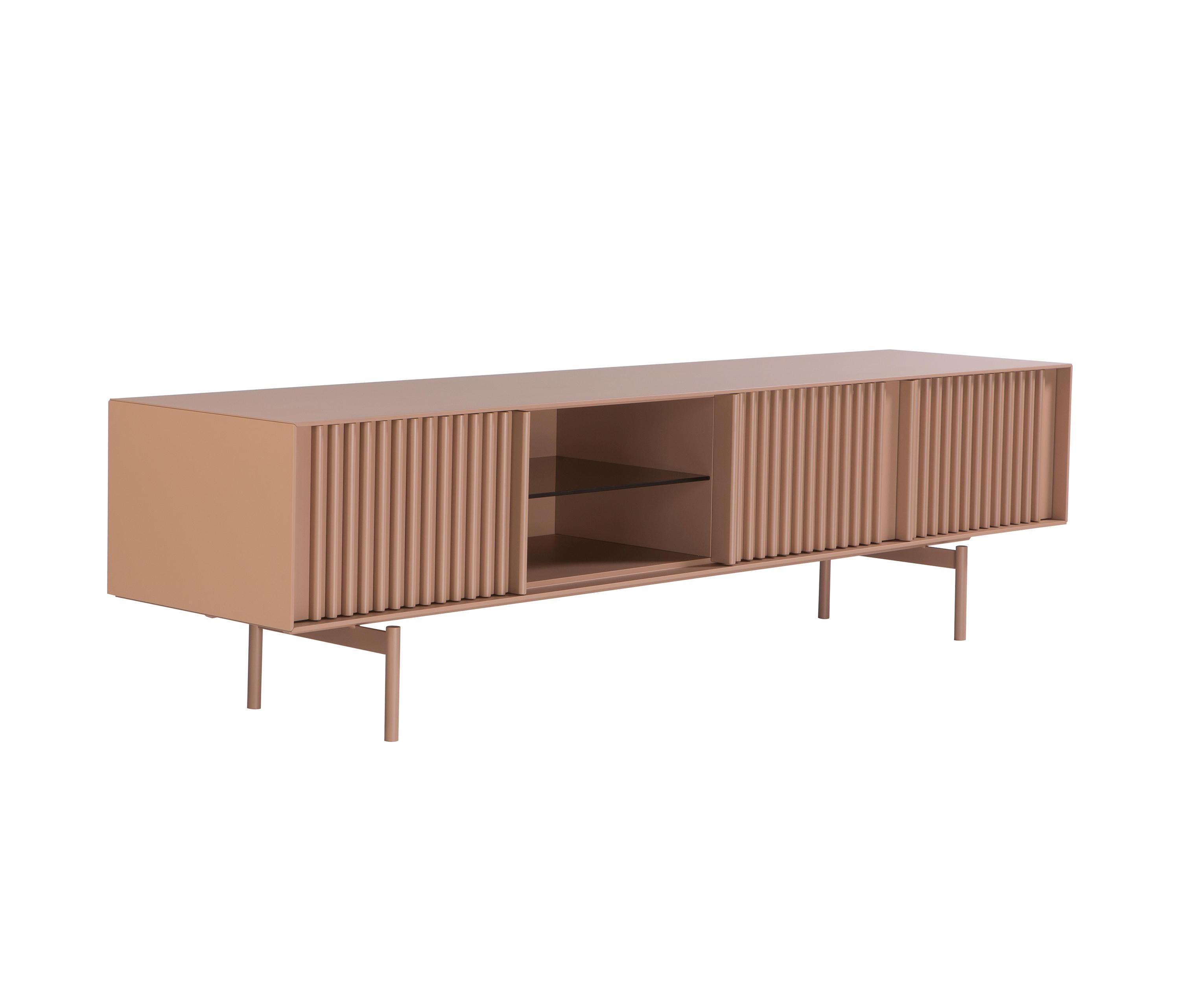 Depending on the chosen material, the TV unit can have a classic and at the same time a more pop character.
Materials : Fronts lacquered, The base is metallic. 
Available in different sizes and finishes.
The price is subject to change by choosing