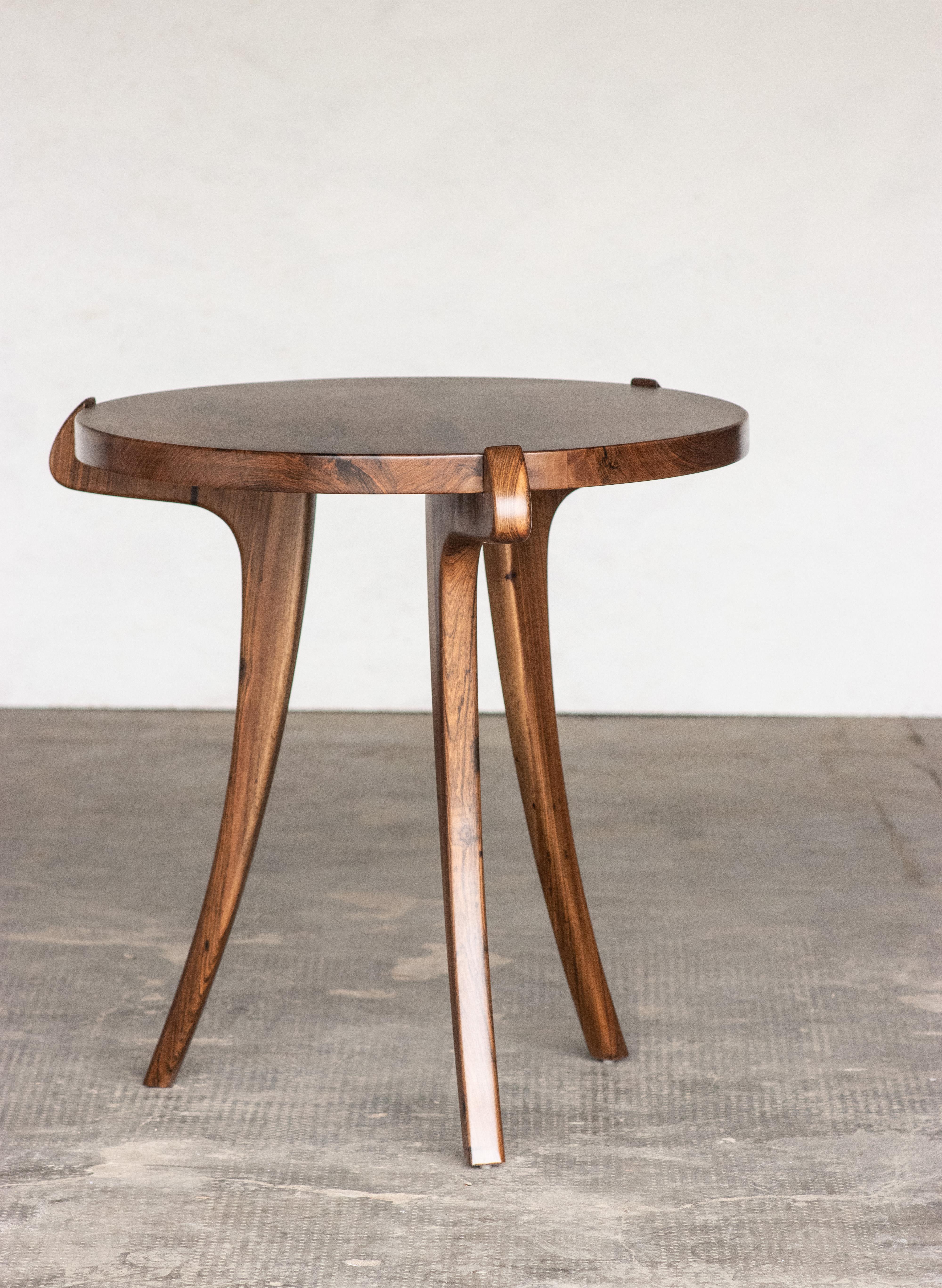 The Uccello occasional table features a solid wood sabre leg that slightly rises above the surface of the top, that can be made in any species wood. Also available as a console or dining table.

Shown in sustainably sourced natural Argentine