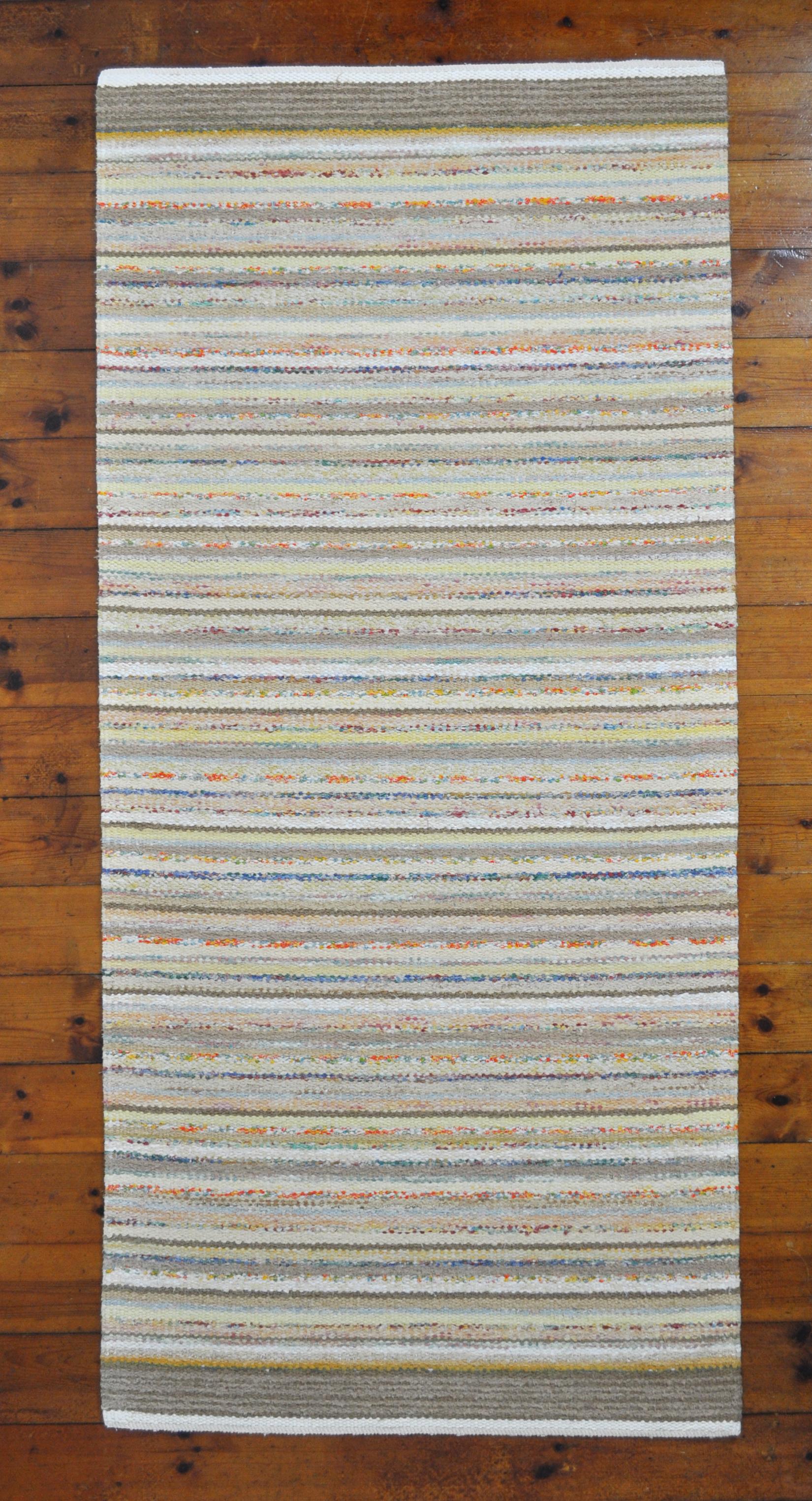 Unique Danish rug in recycled colored materials. Handwoven in the traditions of Scandinavian rugs. High quality craftsmanship by MB handwoven rugs. Can be washed without loosing color or shape.