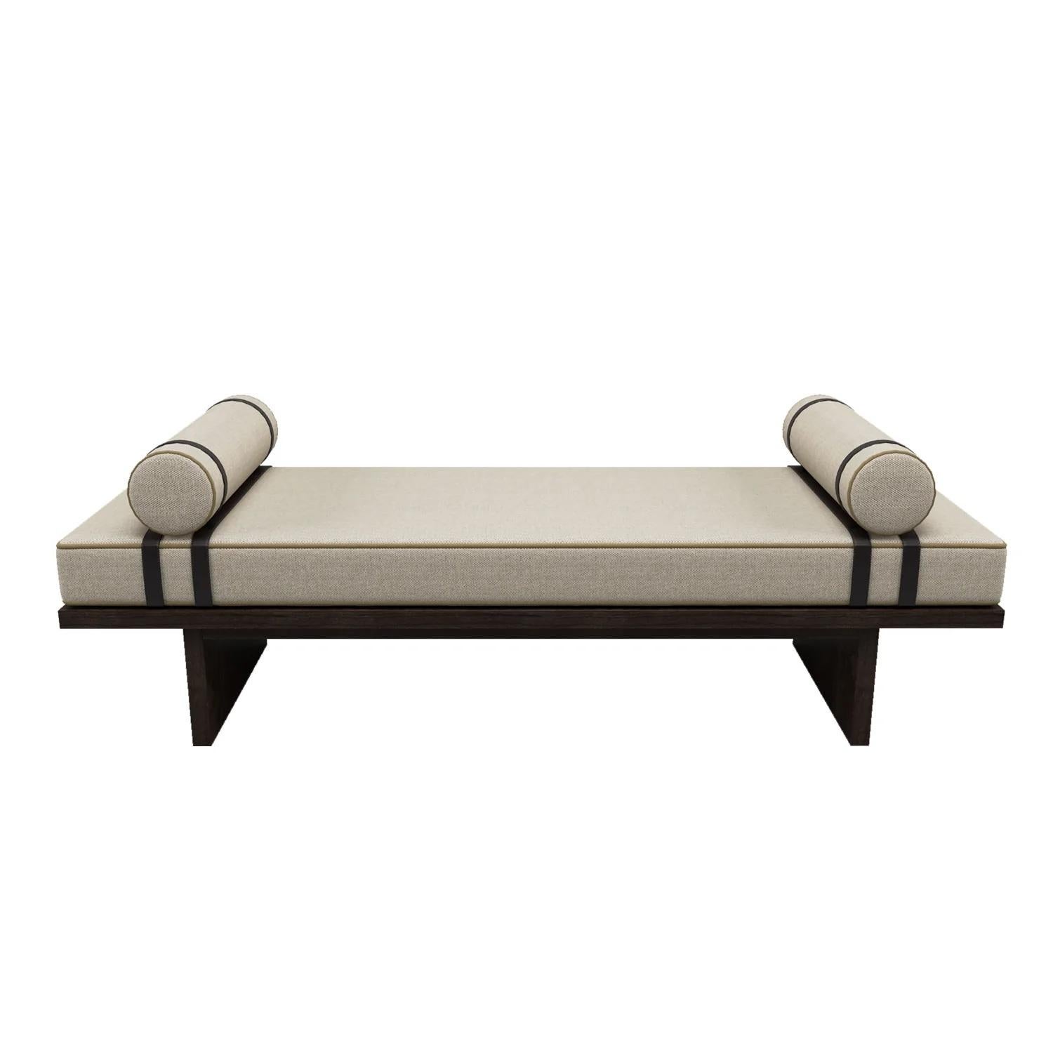 This bench is as great to look at as it is to sit on.  Always eye pleasing with contrast cording, chocolate brown leather straps and ebony wood finish.  As comfortable in a den as it is elegant in a sitting room,
Contact us to inquire about COM/COL