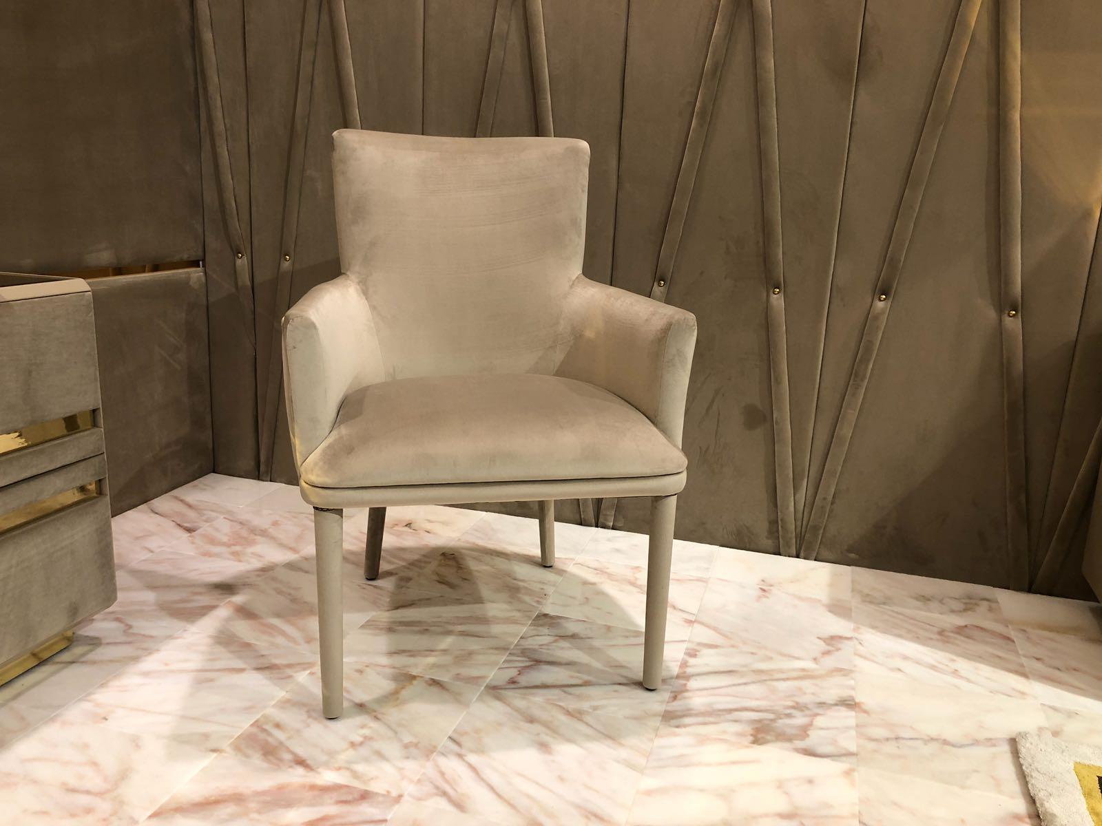 The contemporary upholstered designer occasional chair is an example of charming beauty, original and ornate. Casual chic style, with or without stud detailing as shown. Exquisitely opulent, a small armchair that would suit both a classic and