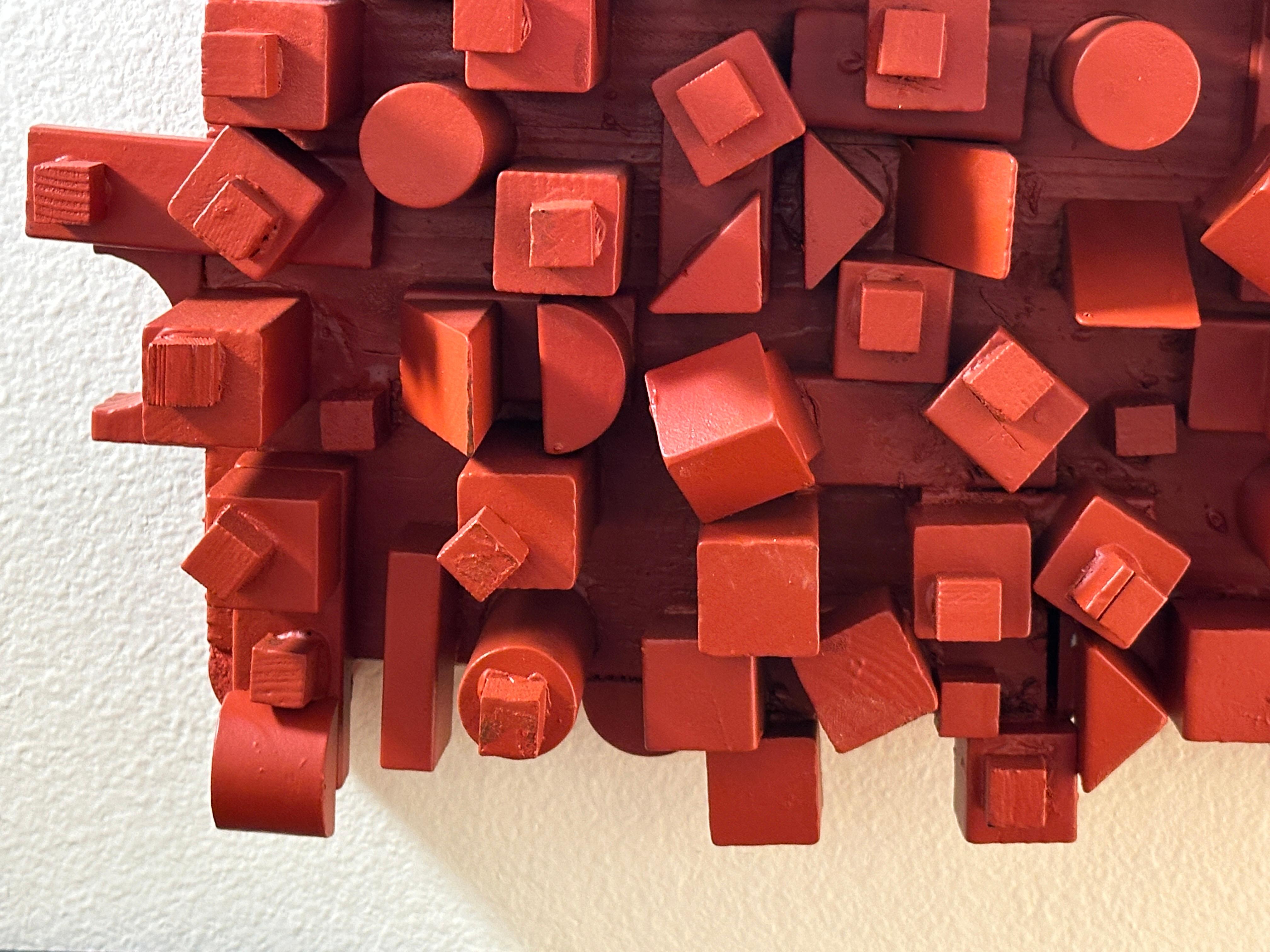 
Cette sculpture murale urbaine contemporaine rectangulaire en bois rouge.  signée C.Cultz, présente un amalgame de formes géométriques apparemment aléatoires, mais composées avec art.

Cette sculpture murale exubérante présente un assortiment de