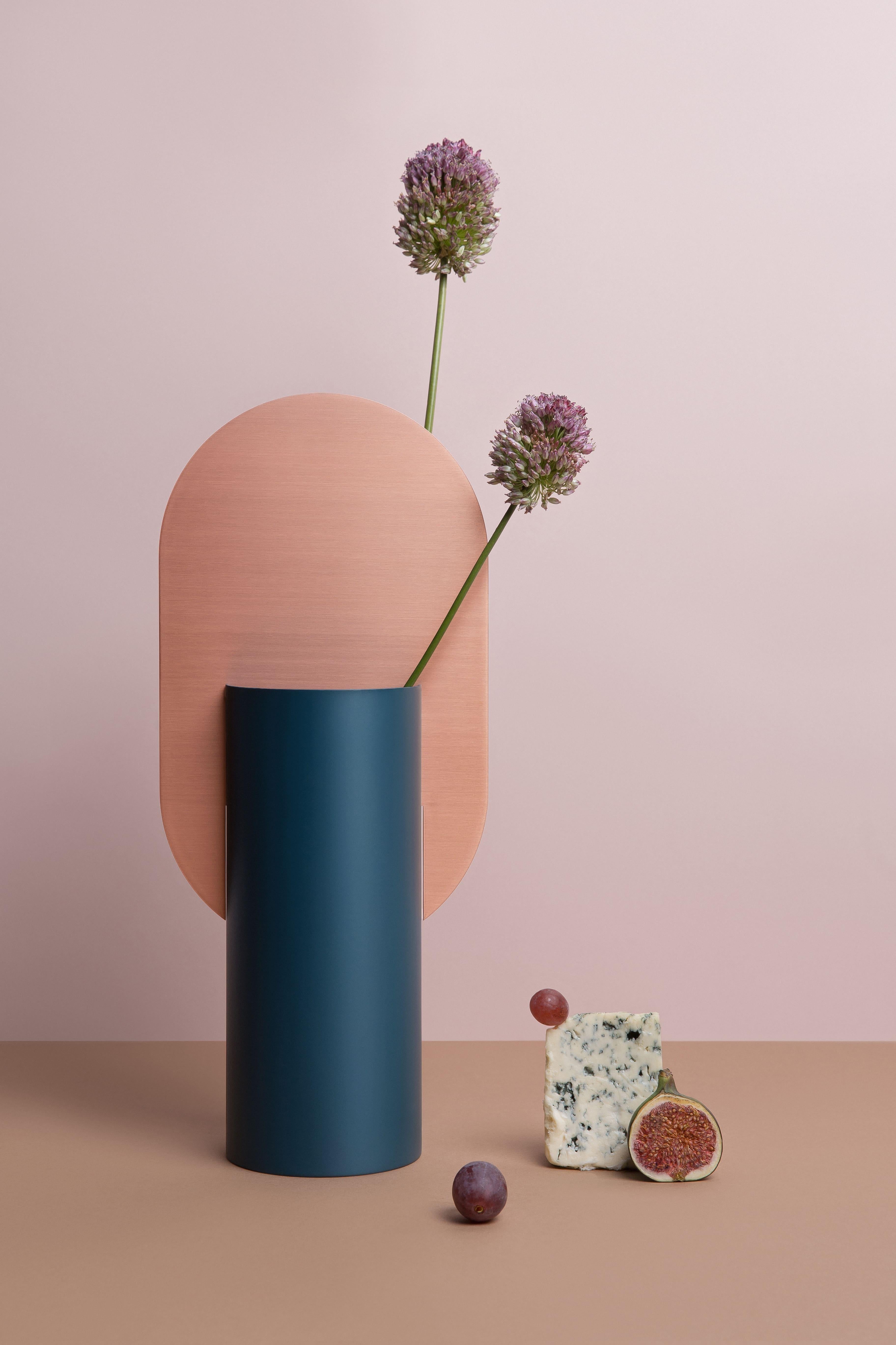 Vase Genke CS2 by Noom in Copper and Steel

Brand: Noom
Designer: Kateryna Sokolova
Materials: Brushed copper, painted steel
Color scheme: CS2 - ocean blue and copper
Dimensions: H 38 cm x W 17 cm x D 10 cm
Net Weight: 2 kg.

Genke vase, one of the