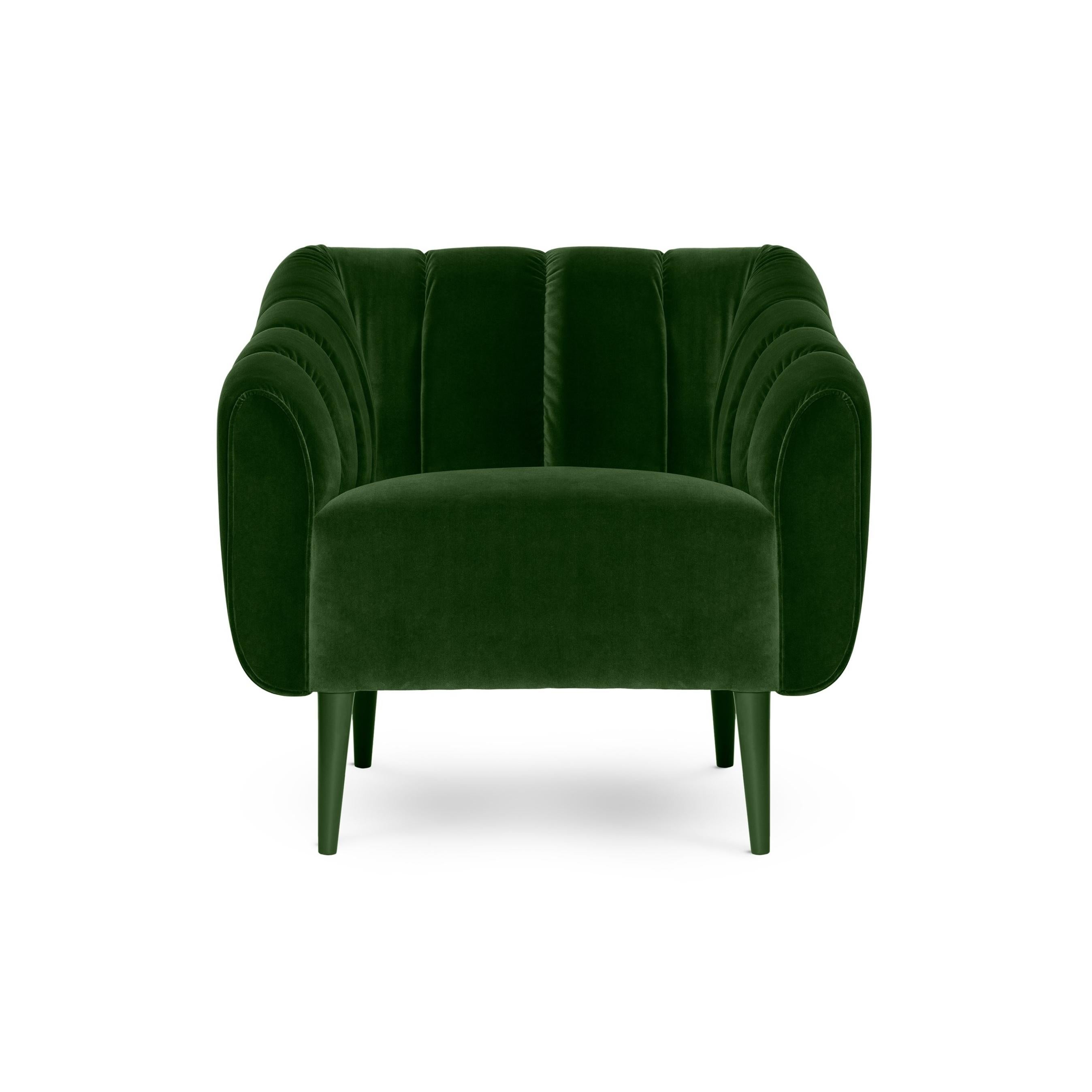Designed with a thorough but playful attention to geometry and form, this armchair has a glamorous 60s and 70s sci-fi retro look. Its quilted upholstery is reminiscent of the midcentury aesthetic, with proportions suited for contemporary living