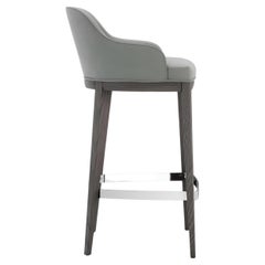 Sgabello contemporaneo in velluto con base in Wood Wood e poggiapiedi in metallo
