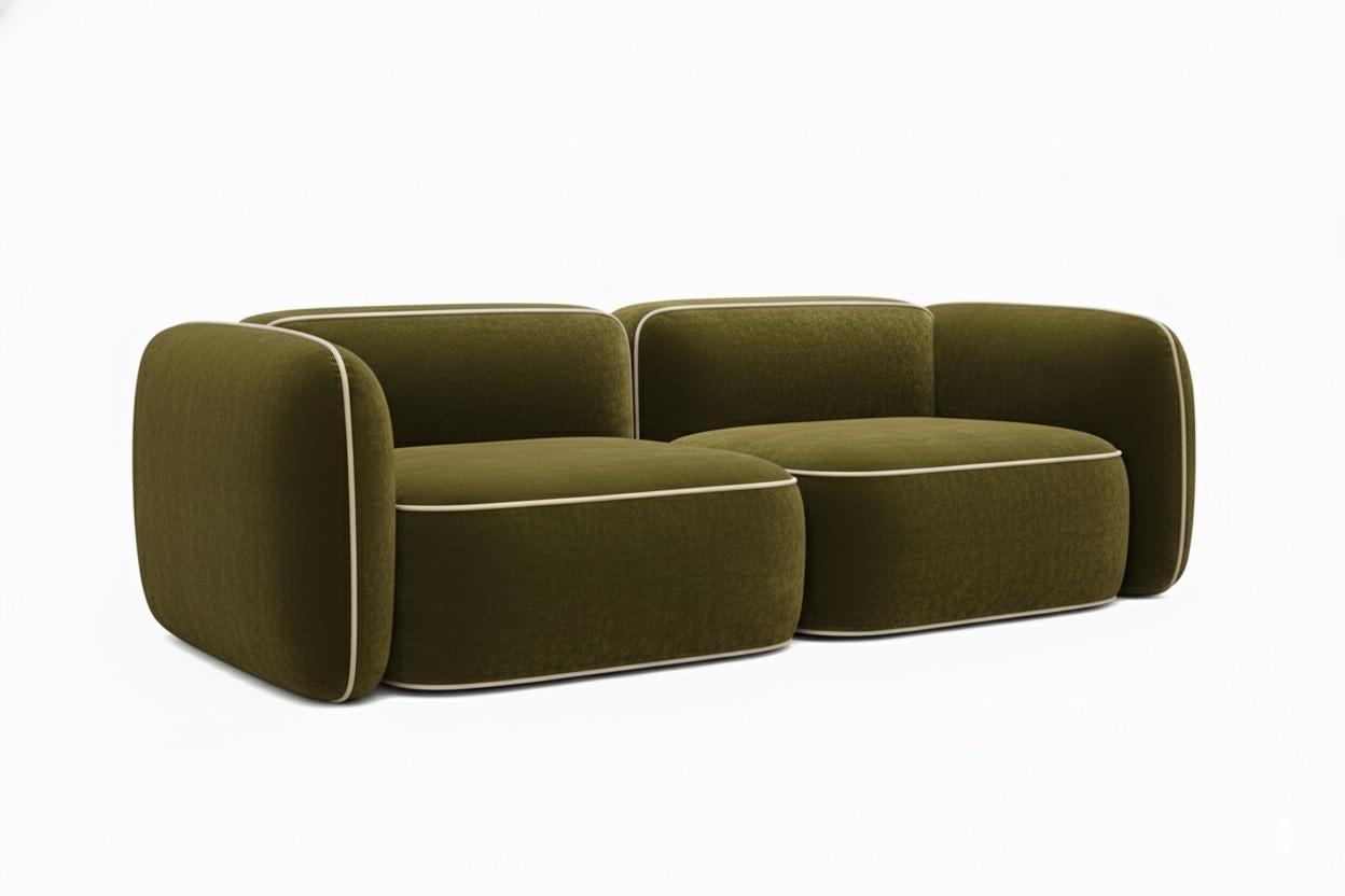 Divano modulare minimalista a 2 posti dai contorni arrotondati. Il divano è rivestito in velluto blu scuro. È composto da tre moduli collegati tra loro, che gli conferiscono un aspetto simmetrico.
Un dettaglio particolare è rappresentato dalle