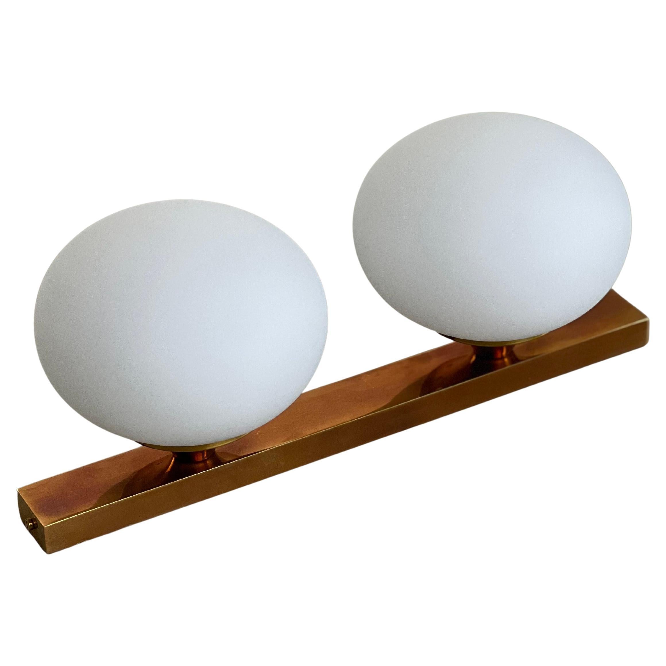 Flush Mount , Wall Sconces , Light Fixture , Art Deco Style 

Offered for sale is a stunning contemporary wall light, designed and hand crafted in Milano, Italy by expert artisans using brass and opaline with glass bowls . Penned in a modern