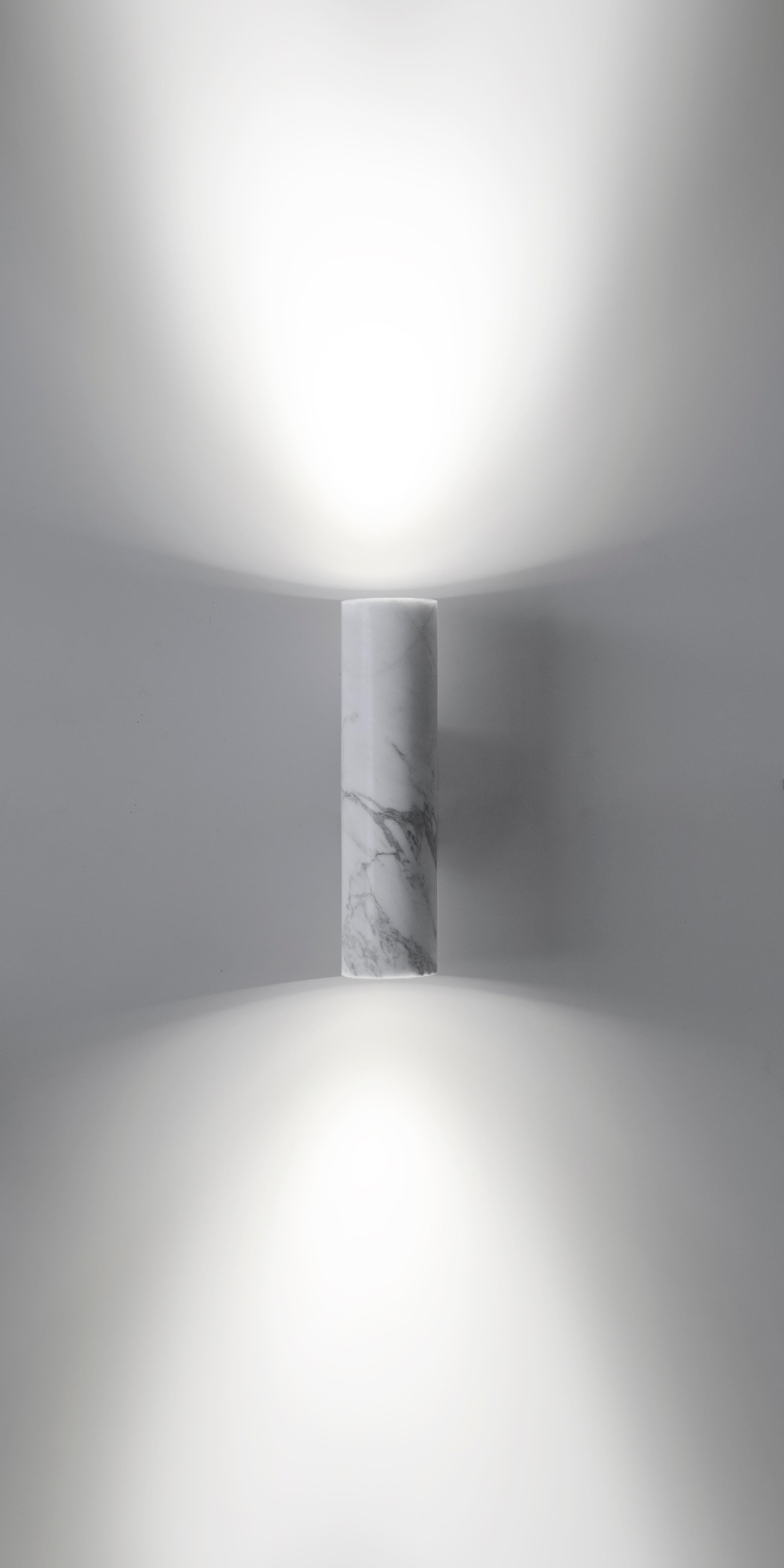 Wall lamps 'W01' by Buzao x Bentu design.

Black lava stone or white marble

Measures: 27.5 cm high, 7 cm diameter, 12 cm width,  

Lamp type: LED Integrated 2W 100-240V 80Ra 200LM 3000K.

Bentu Design's furniture derives its uniqueness from the