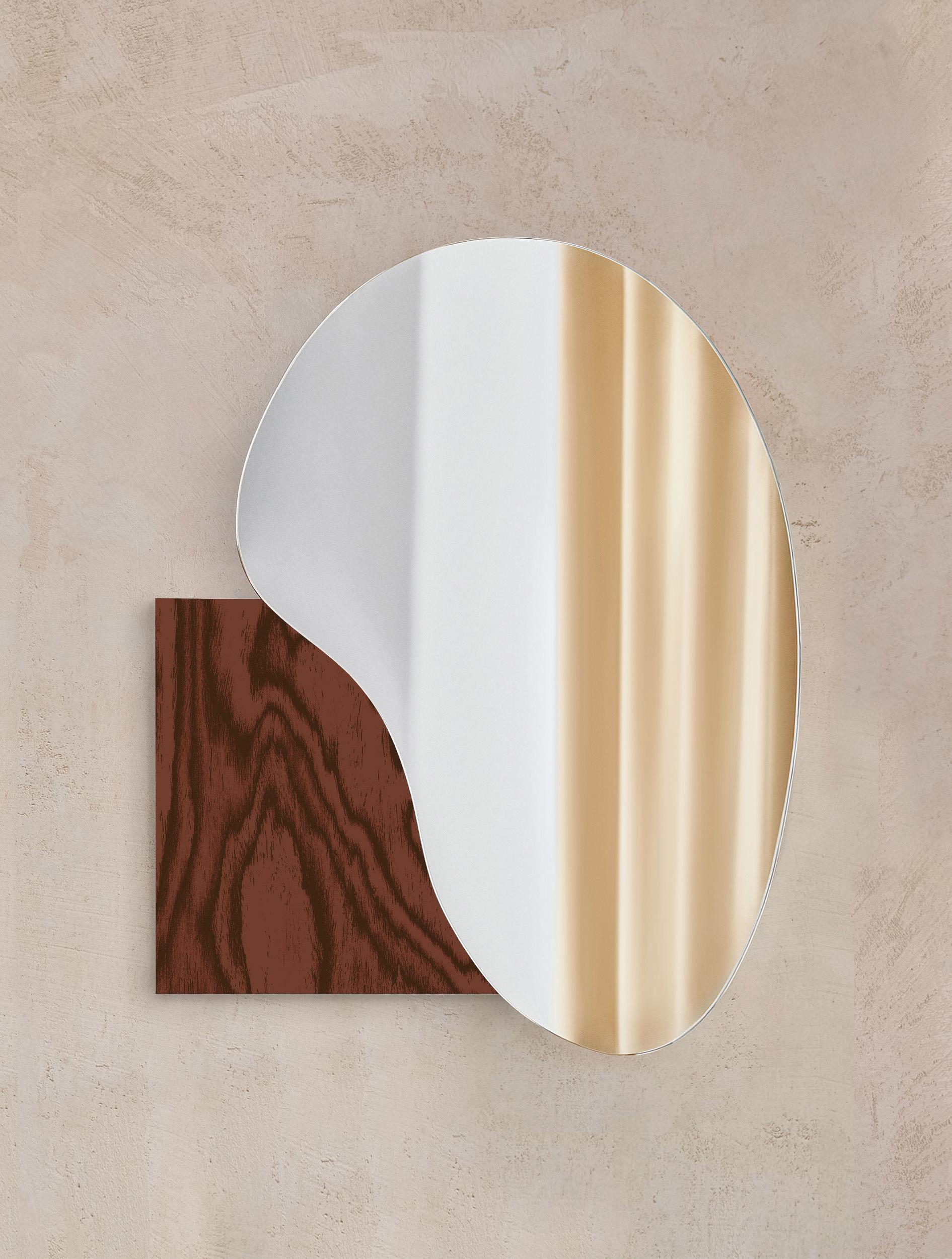 Brand: NOOM
Designers: Maryna Dague & Nathan Baraness.

Type of Mirrors: Optiwhite, Black tint mirror, Copper tint mirror.
Materials for base: Veneered wood, Madrona wood veneer, Burned steel, Stainless steel / Hand brushed stainless steel, Brushed