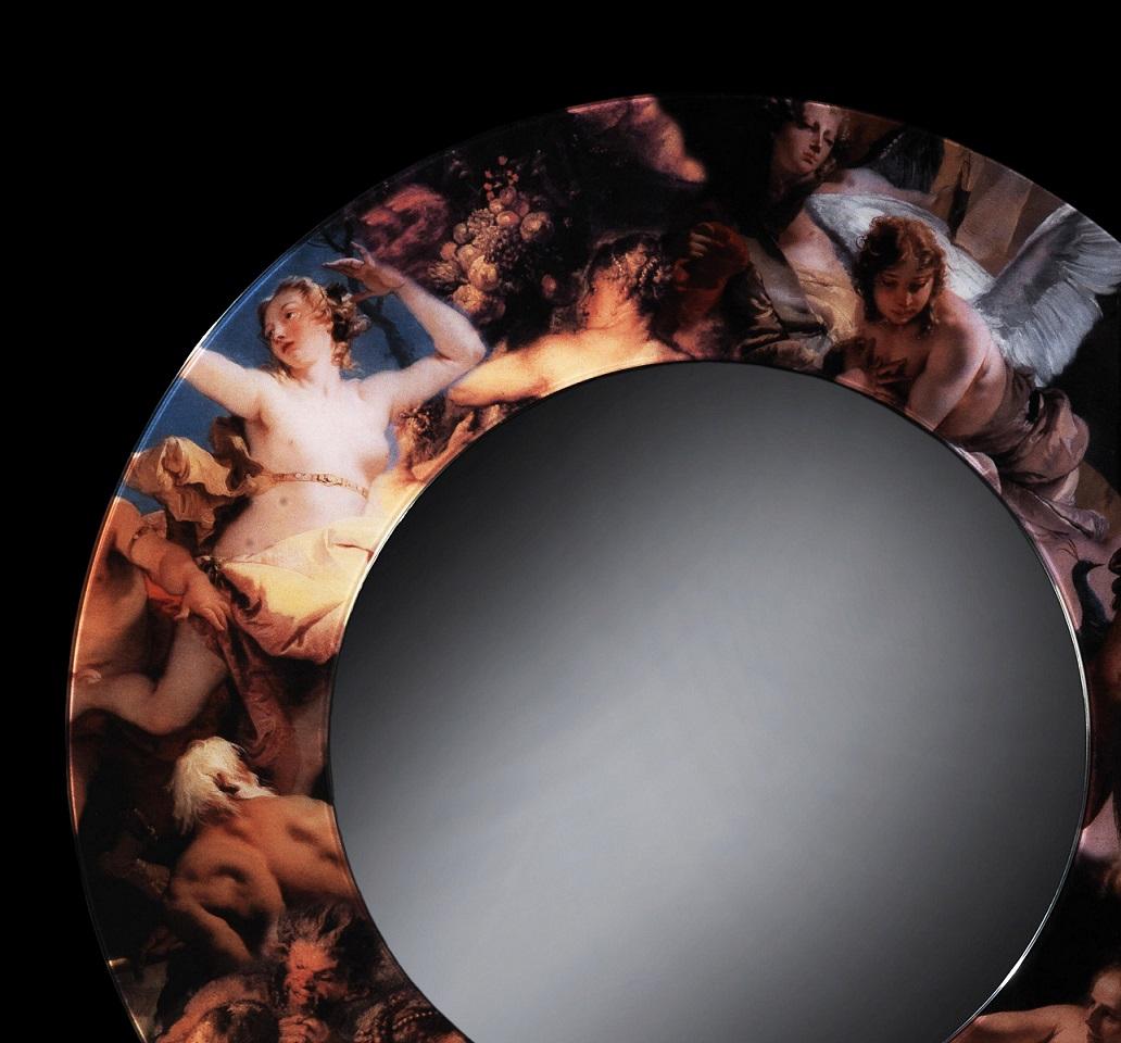 This mirror is made up of two glass laminates. The frame that surrounds the mirror is a collage of six paintings in the baroque style.
Inside these two pieces there is a picture which has been stuck to the glass with butyral of polyvinyl by heating