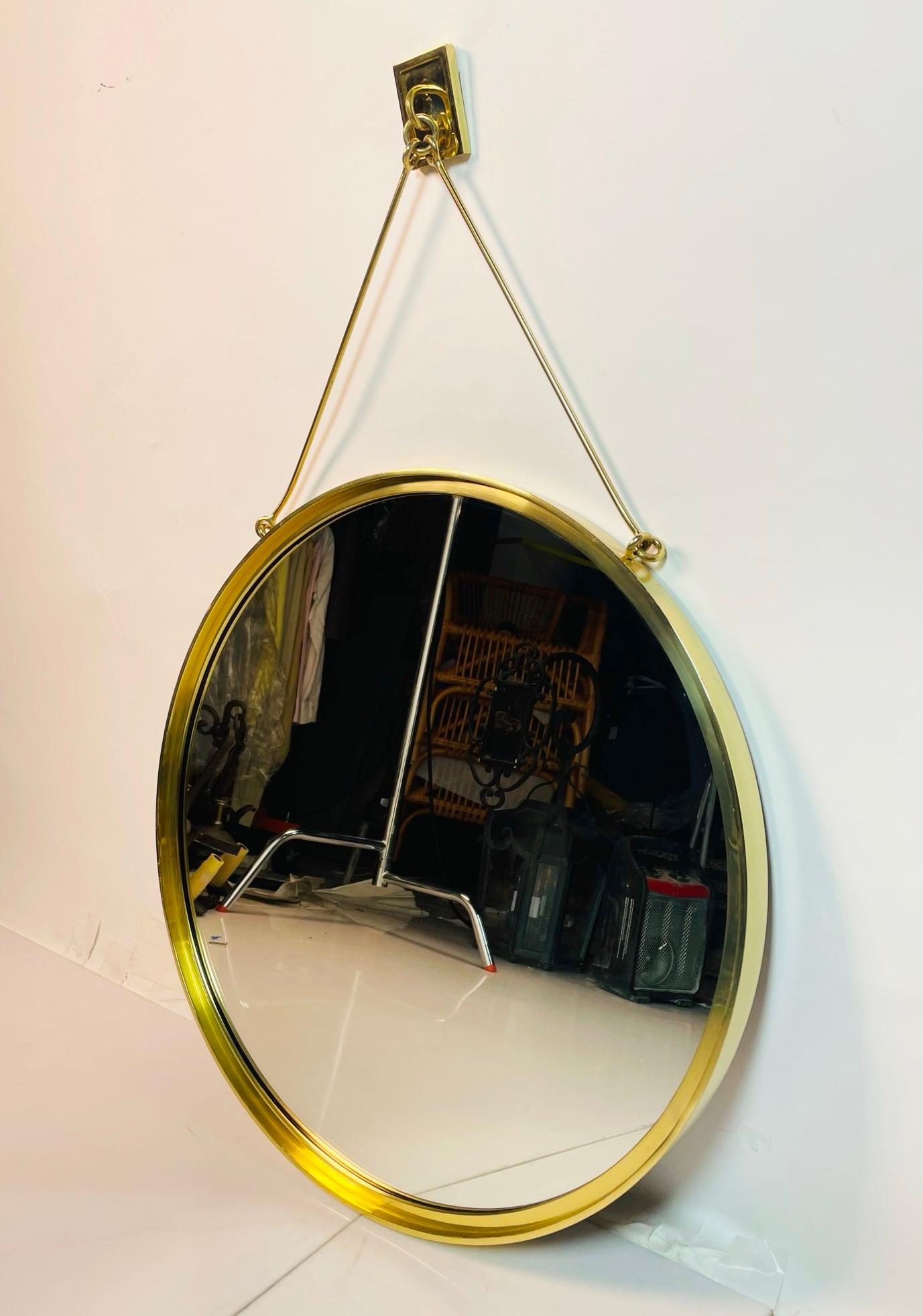 Contemporary Wall Mounted Brass Mirror In Good Condition For Sale In Los Angeles, CA