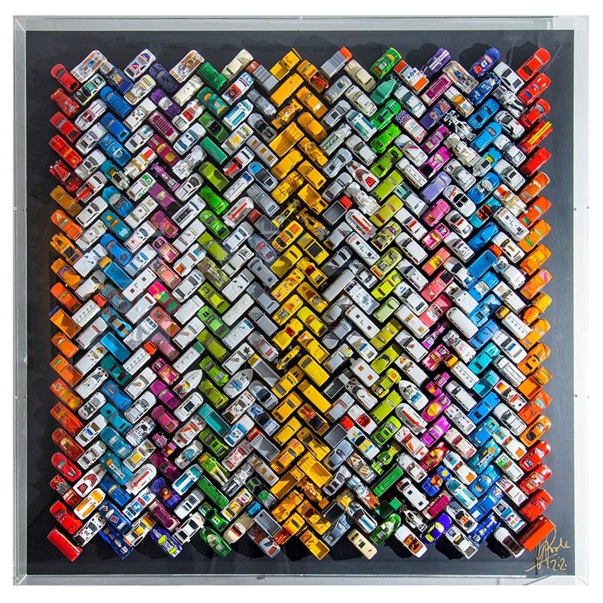 Unique piece.
Titled 'Giant Ziggy-Zaggy Stripey Gridlock', Laurence Poole's clever colour composition expressed through precise arrangement of 400 vintage toy cars, is a joyful and captivating wall sculpture to brighten an interior and delight